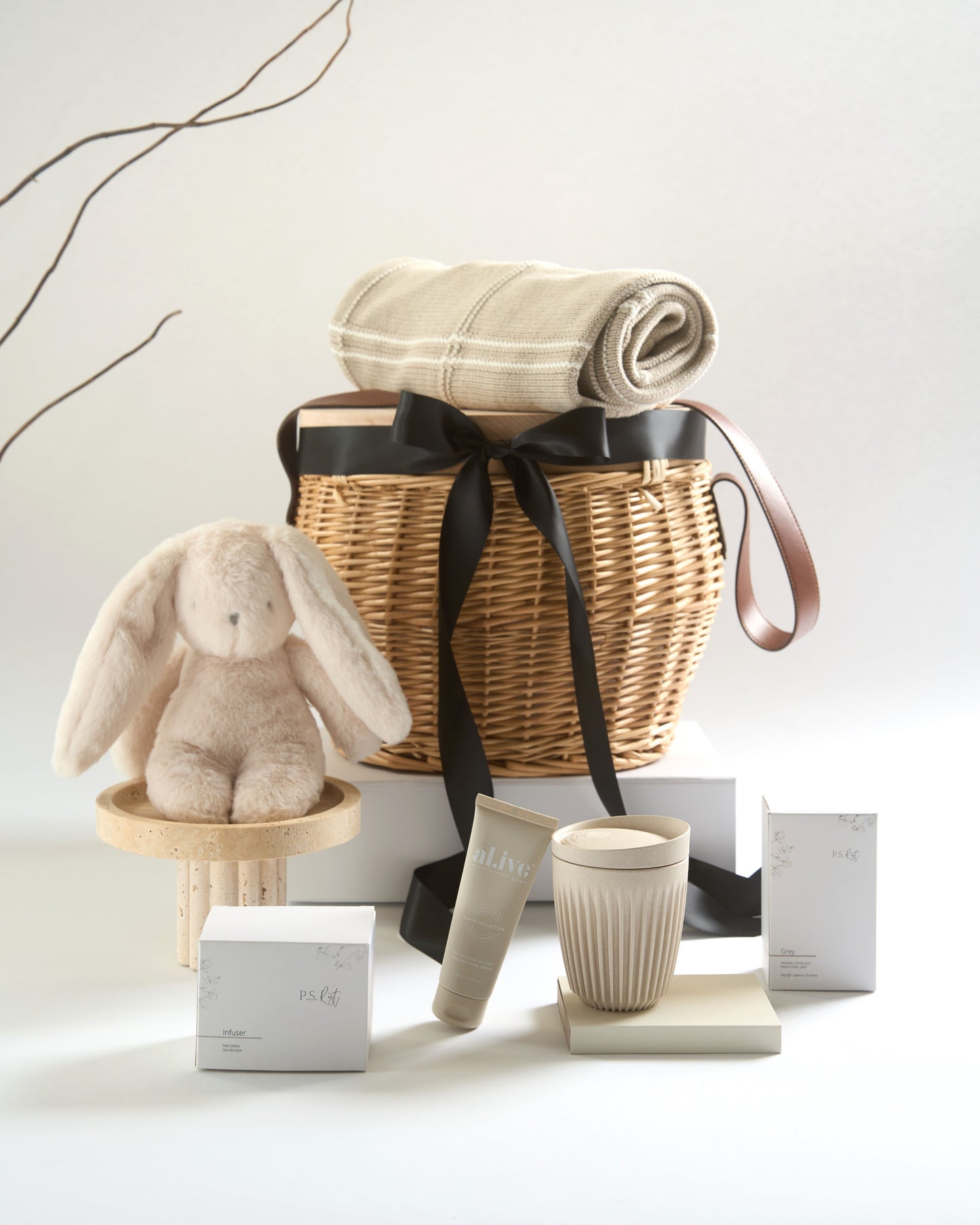 Beautiful lucury wicker picnic basket Gift includes a cable blanket in latte, Darcy plush Bunny, Reusable Huskee Coffee Cip, PS Rest Tea and Infuser.