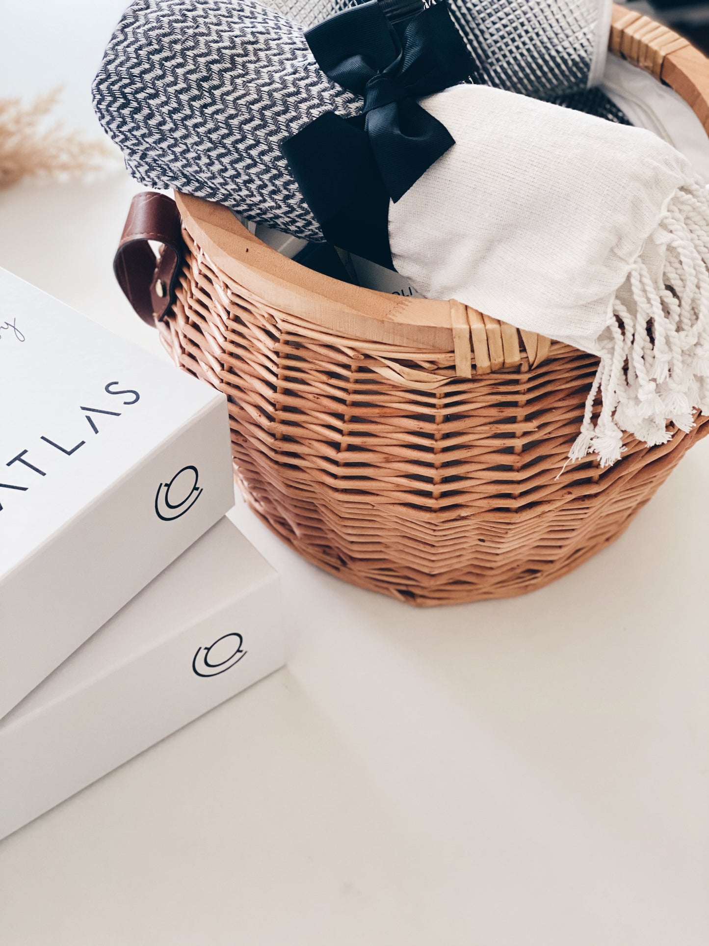Parcelle | luxury Beach Round Picnic Basket with Throw towels presented with matching branded Gift Boxes for Atlas Real Estate