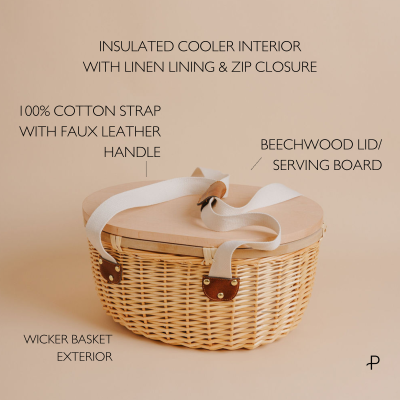 Parcelle | Elegant insulated wicker picnic basket with a comfortable shoulder straps and wooden oval lid that doubles as a cheese board. Features a spacious, zip-lined interior, perfect for keeping food and drinks hot or cold. Customizable with corporate logo engraving on the lid, ideal for both business and personal occasions