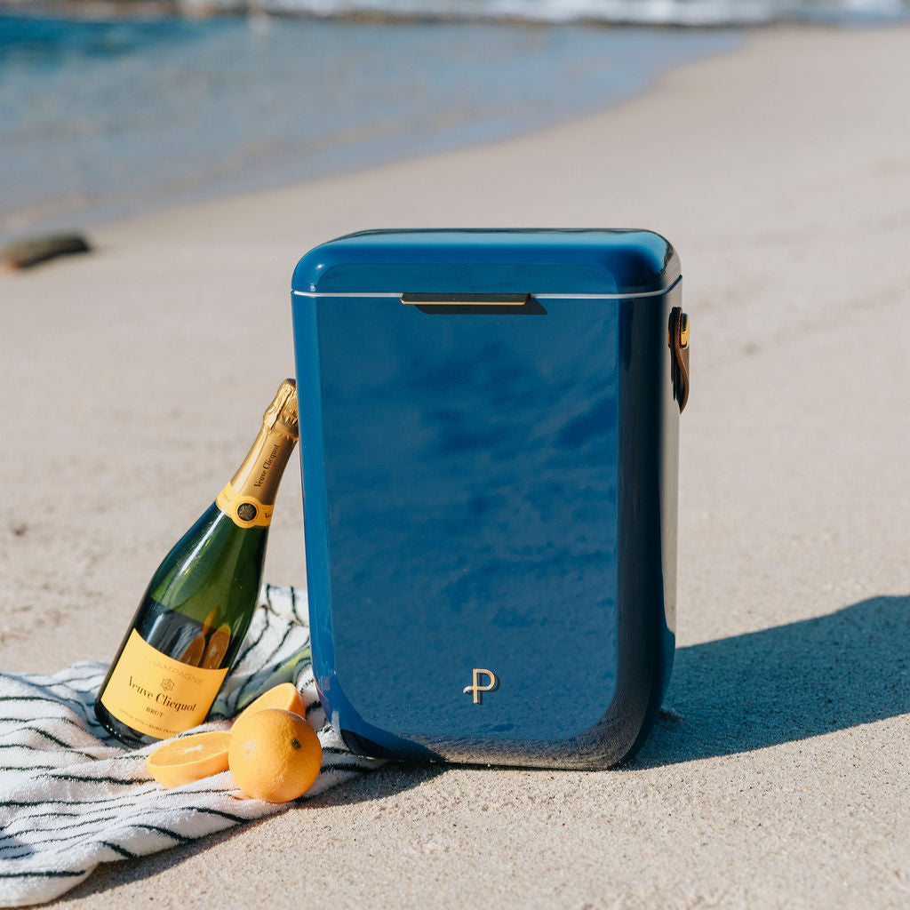 Parcelle | French Navy Kewlr cooler with PU leather strap and champagne inside, ideal for premium corporate gifting and summer picnics