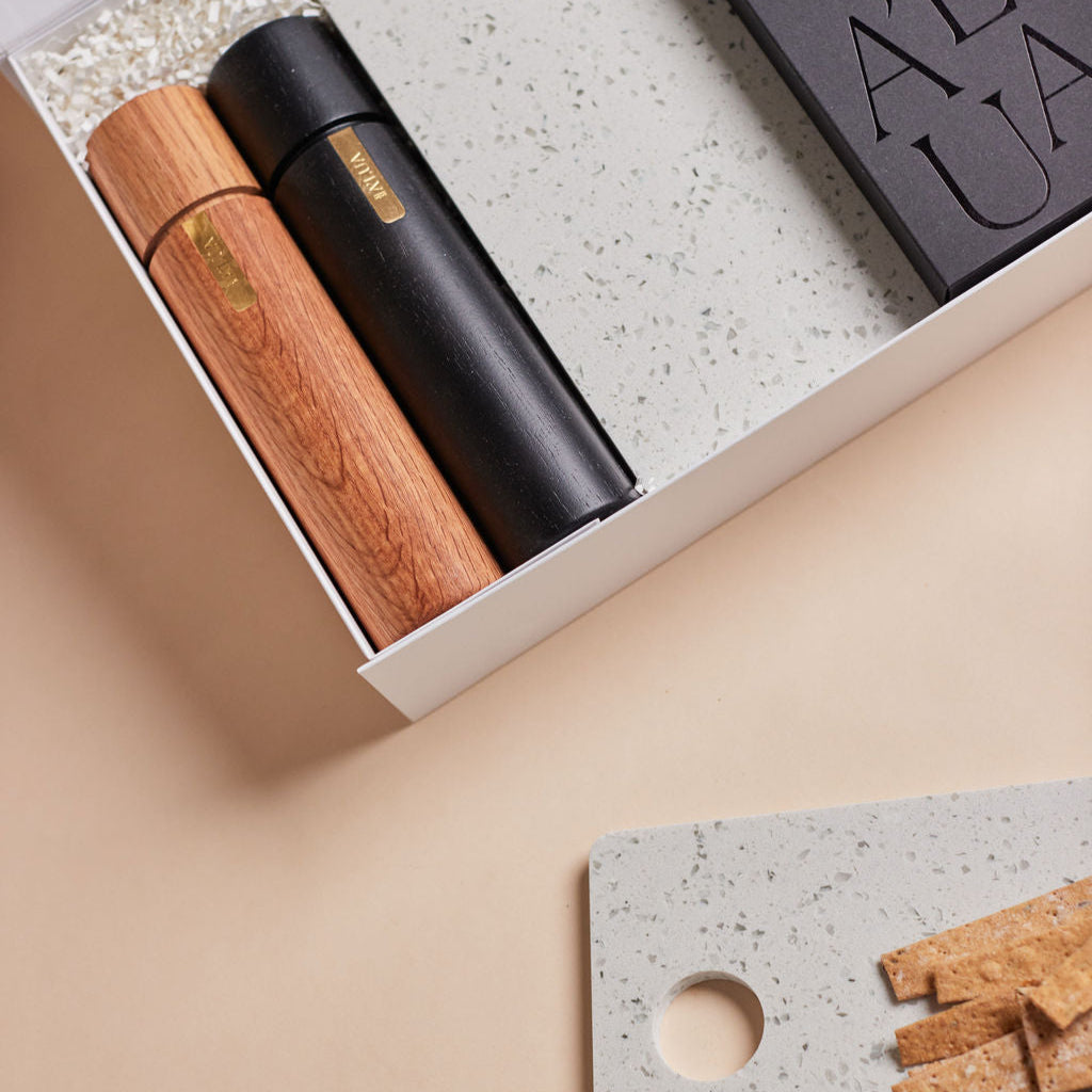 Parcelle | The Terrace luxury property settlement hamper with olive oil, terrazzo stone serving board, wooden grinders, and cheese knife set in Parcelle gift box