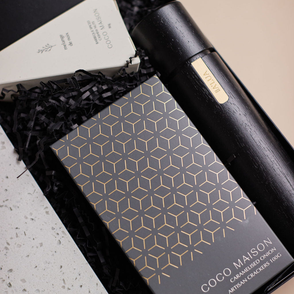 Parcelle | The Studio settlement hamper with olive oil, artisan crackers, terrazzo board, BBQ cashews, and black wooden grinder — corporate housewarming gift Sydney