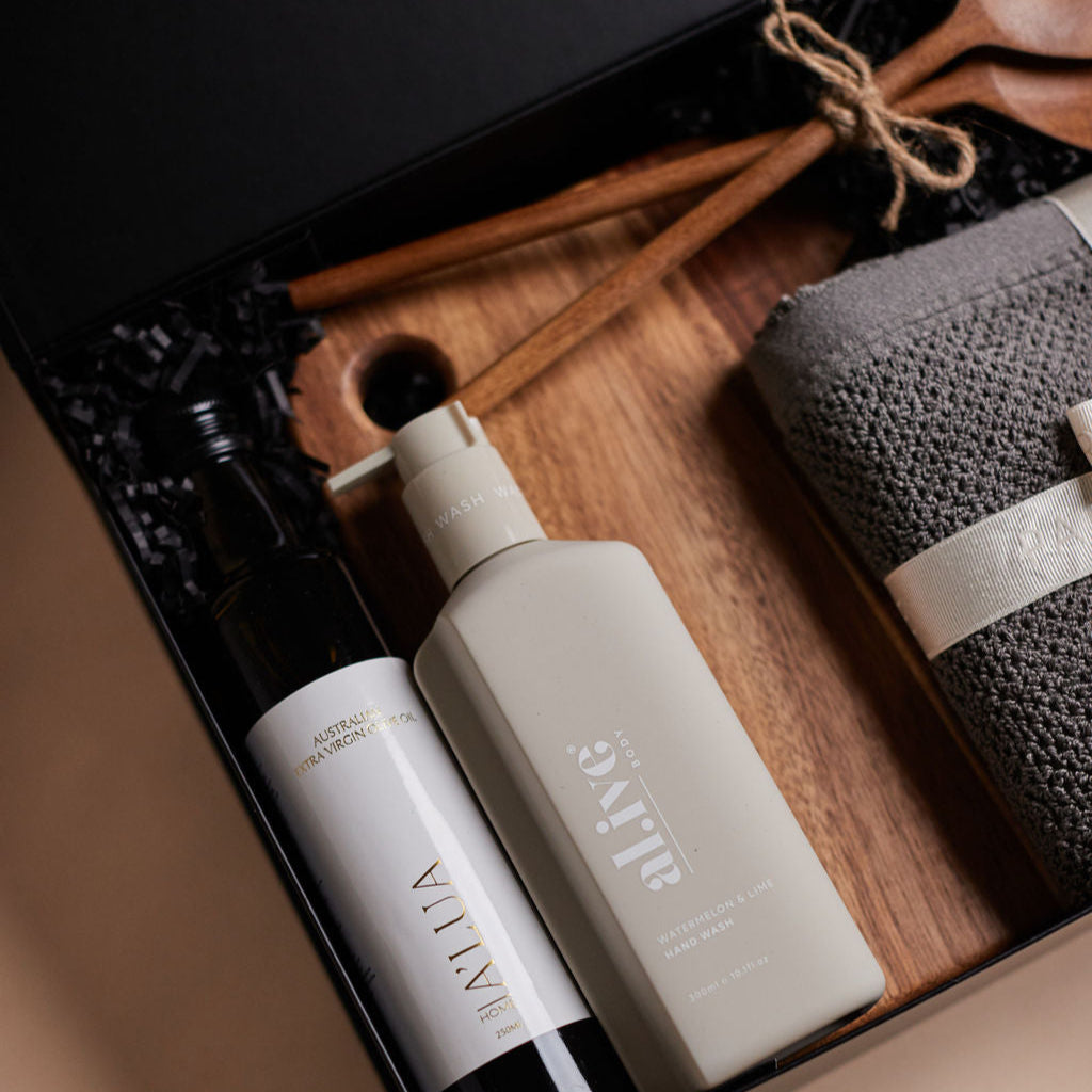 Parcelle | The Bungalow housewarming gift box with olive oil, hand wash, wooden salad servers, face washers, and wooden board — perfect real estate settlement hamper.