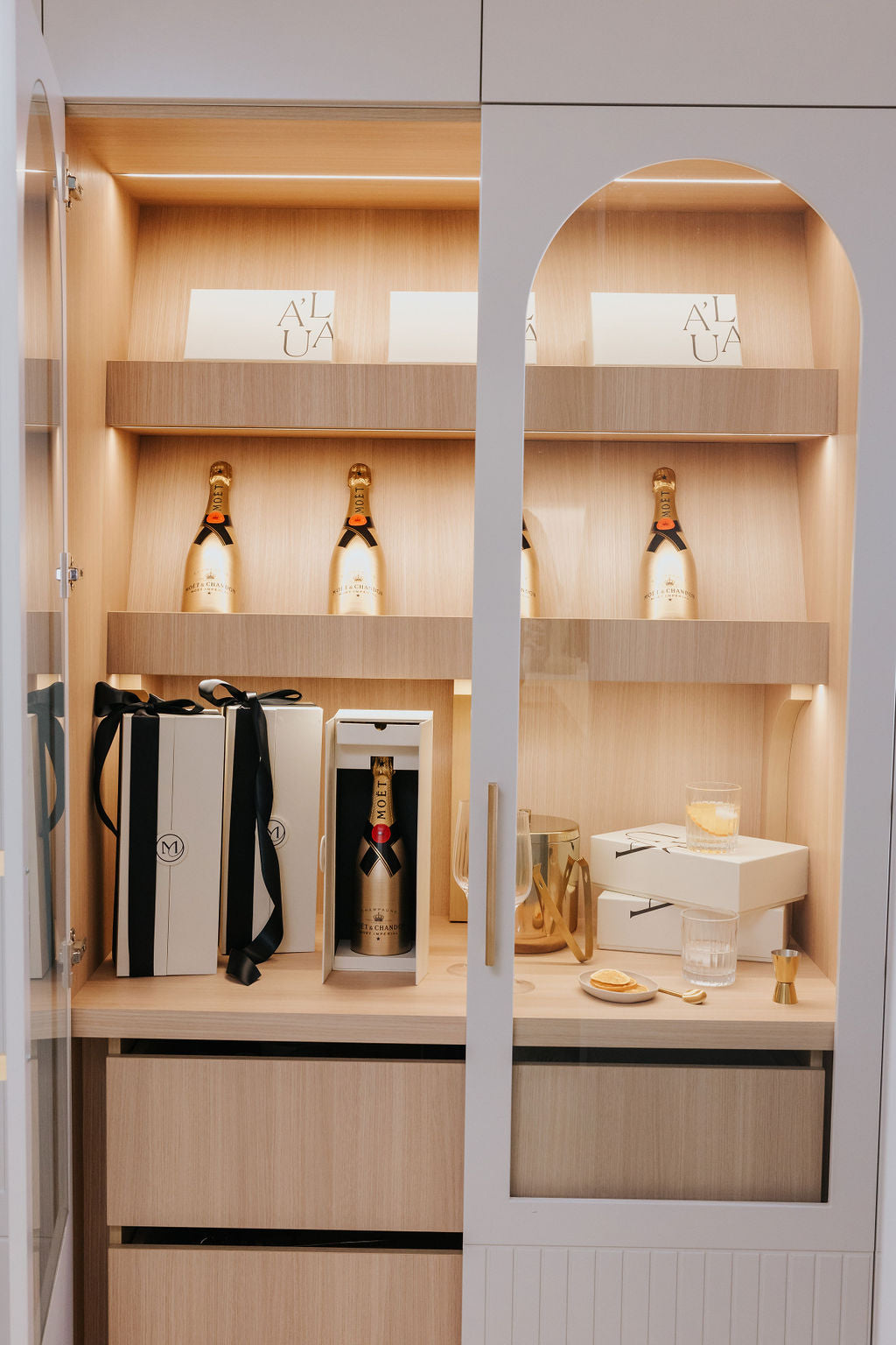 Parcelle | Video of a recipient opening the Christmas Cellar Gift Box, revealing the elegant double-door wine gift box with Gold Moet & Chandon and a hidden drawer filled with Belgian chocolates. The unboxing showcases the luxurious presentation, perfect for  client gifts and corporate holiday gifting.