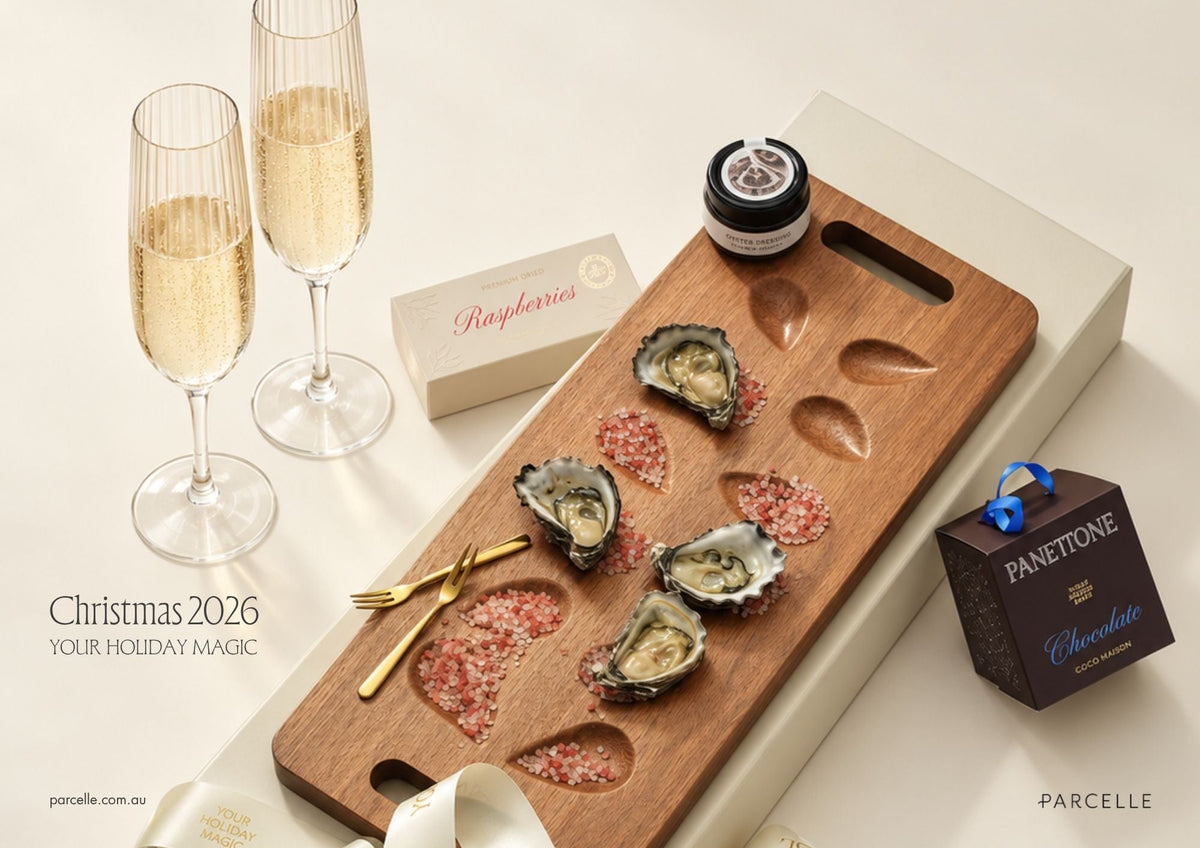 Parcelle Christmas 2026 corporate gifts: timber oyster board with oysters, champagne flutes and Coco Maison panettone