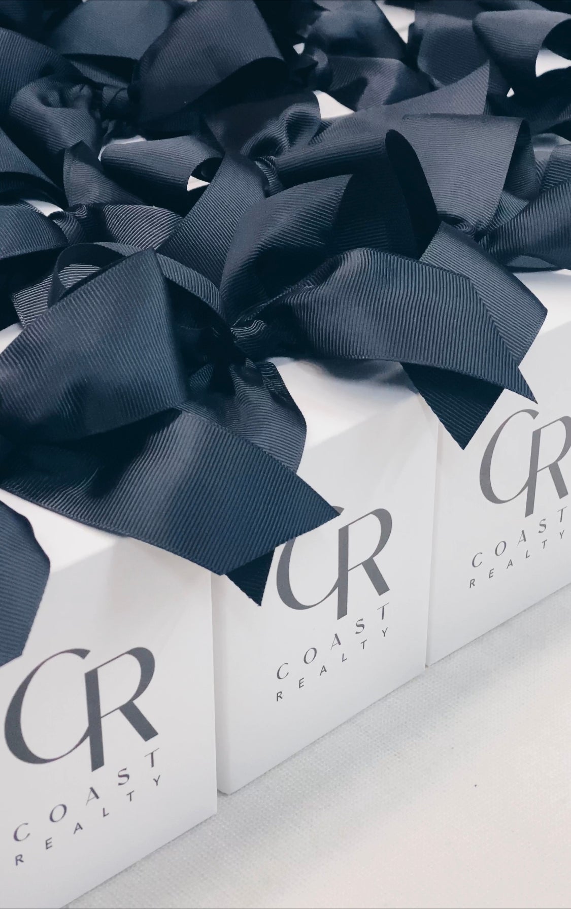 Parcelle | Branded Scented candles and Candle Gift Boxes presented with logo matching ribbon | Coast Realty