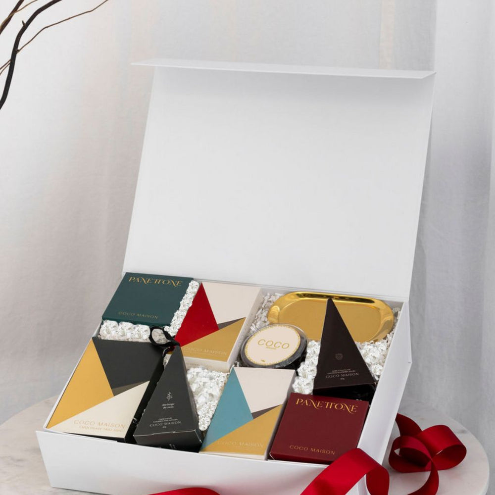 Parcelle | “A Joyous Noel luxury Christmas hamper with Panettone, Pistachio Knafeh chocolate, gold tray & festive treats, presented in Parcelle gift box for corporate Christmas gifting
