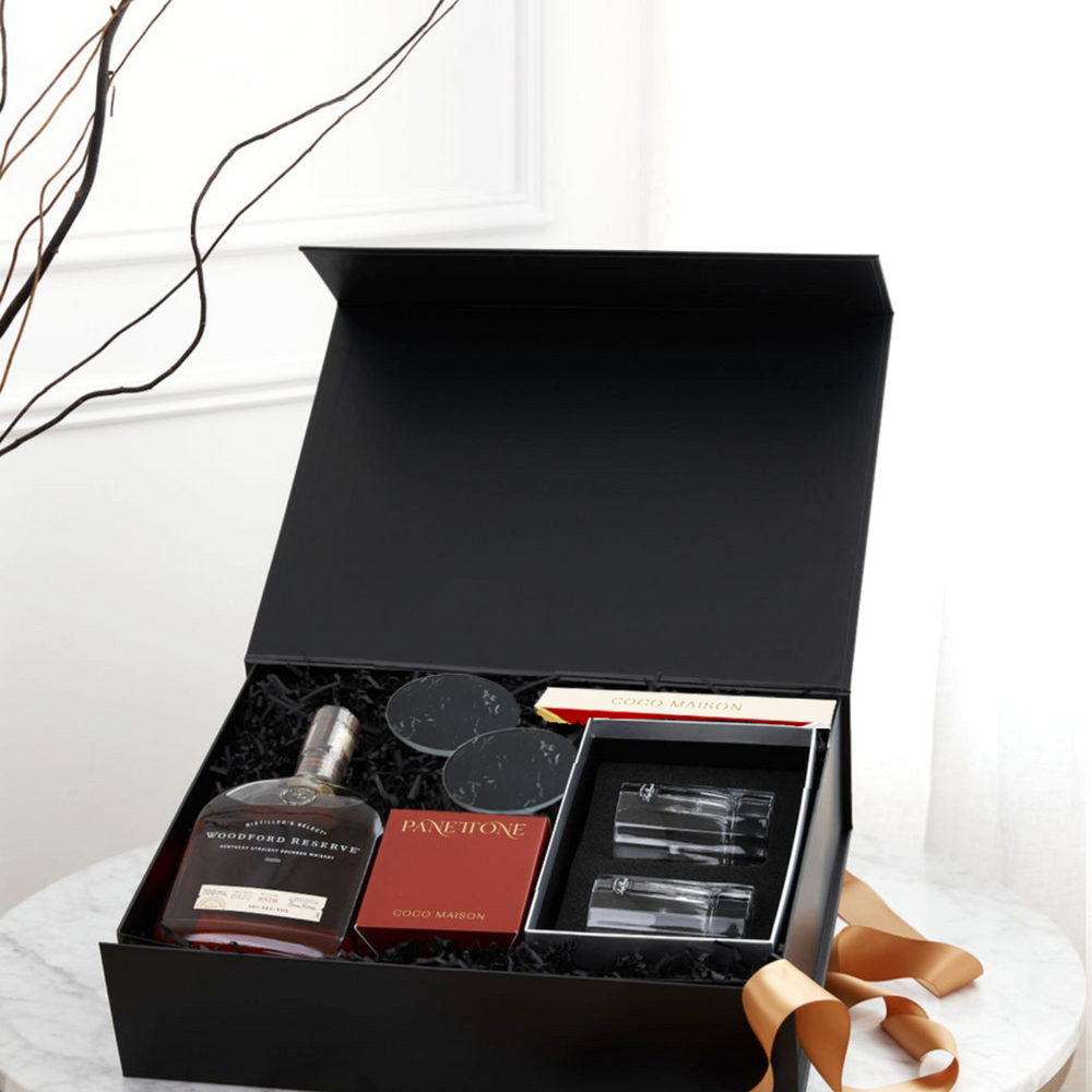 Parcelle | Corporate Bourbon Christmas Hamper with Woodford Reserve, tumblers, marble coasters, panettone and Dubai Biscoff Chocolate in Parcelle XL Gift Box with custom logo branding and ribbon