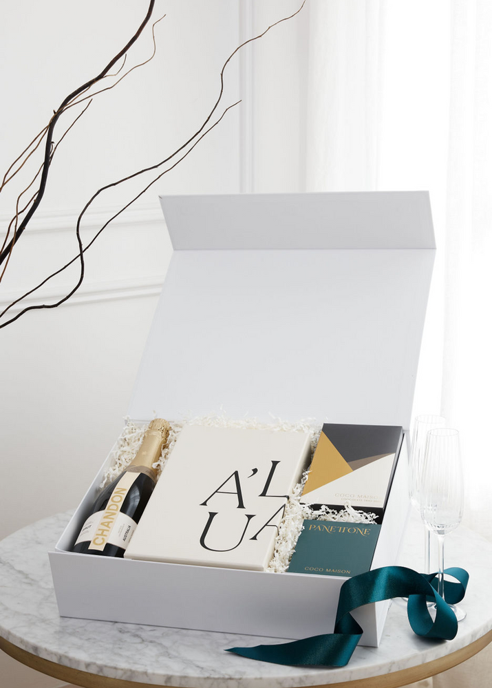 A Sparkling Christmas luxury hamper with Chandon Sparkling, Chocolate Chip Panettone, Chocolate Trio, and Premium Fluted Champagne Glasses, presented in Parcelle XL Gift Box with Australiana or Candy Stripe sleeve, free branding available.