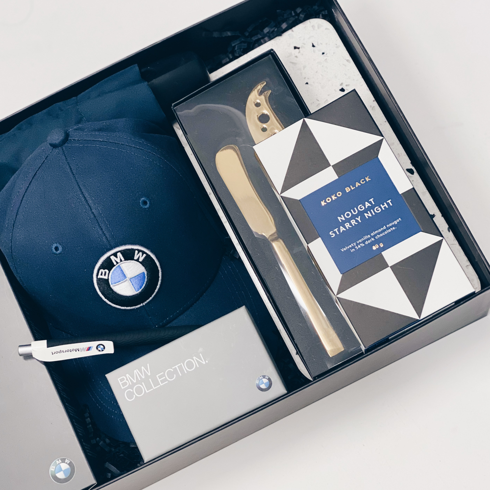 Parcelle | BMW congratulations handover gift including Branded BMW Cap, BMW merchandise in BMW branded gift box