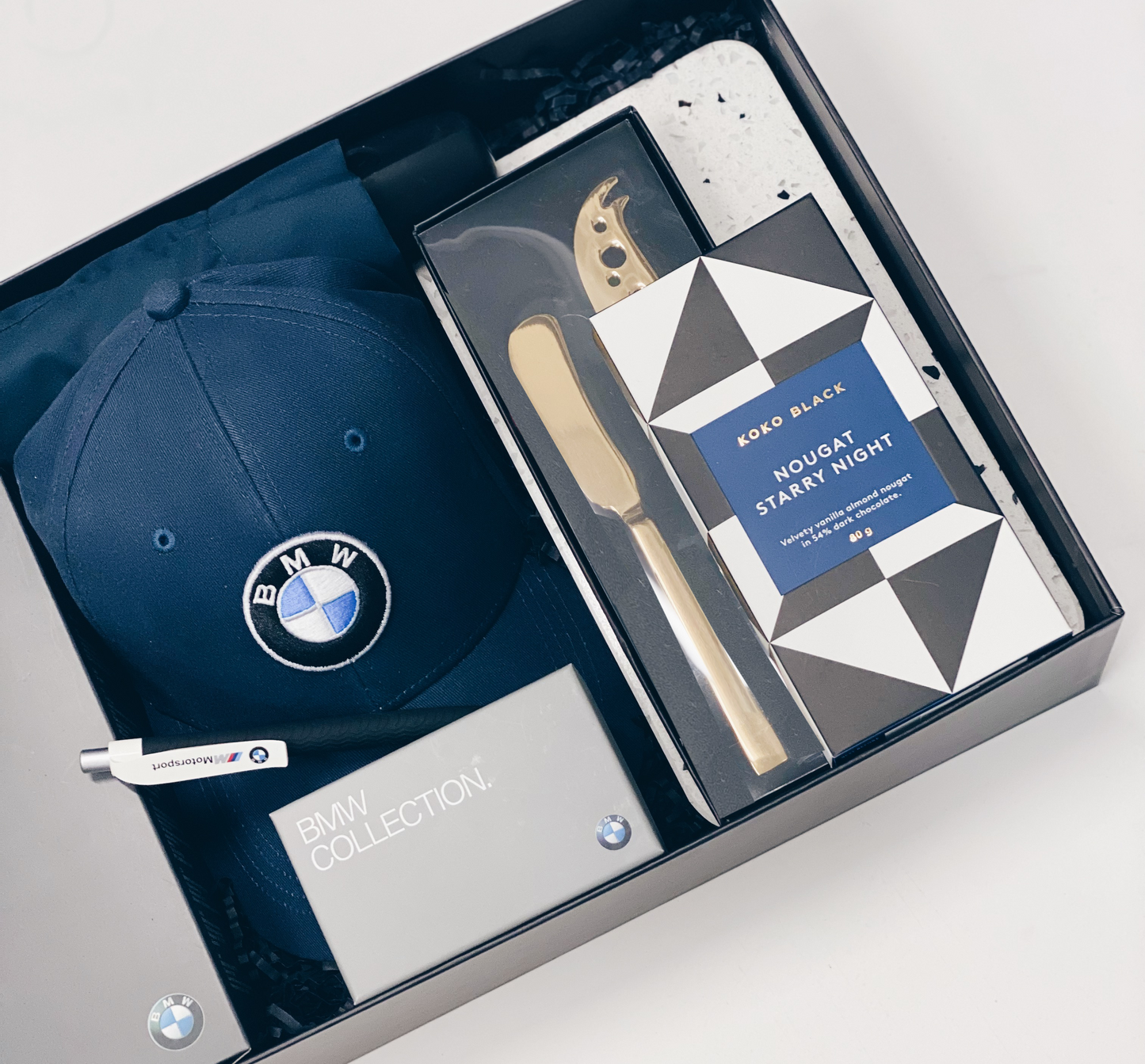 Parcelle | BMW congratulations handover gift including Branded BMW Cap, BMW merchandise in BMW branded gift box