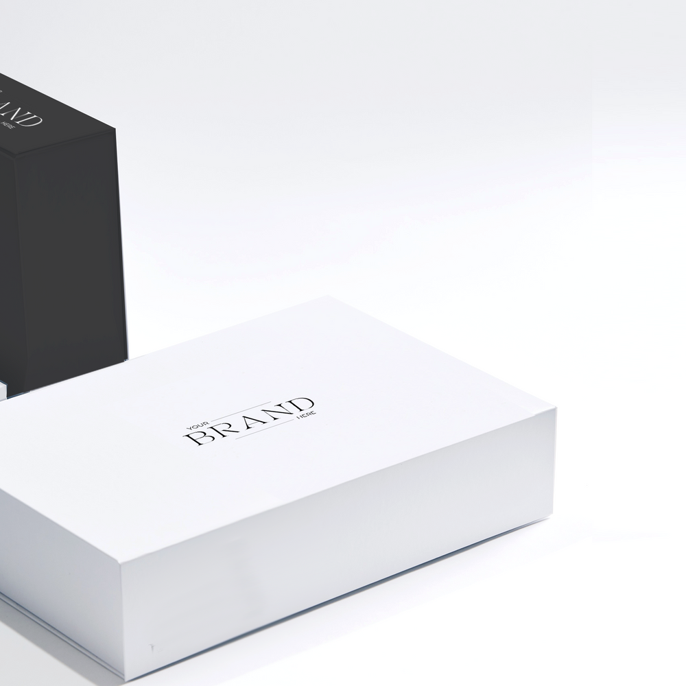 Parcelle Business Gifting for all industries and occasions - a collage of elegant white and black gift boxes with 'Your Brand Here' displayed, highlighting the versatility and custom branding options available to add your company logo and brand to any luxury gift box for a personalized corporate gifting experience.