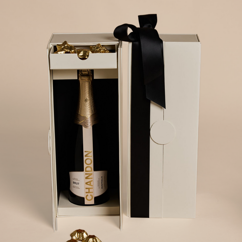 Parcelle | Luxury Chandon Christmas Cellar gift box by Parcelle featuring Chandon Brut NV sparkling wine and Belgian gold star chocolates in a signature double-door box.