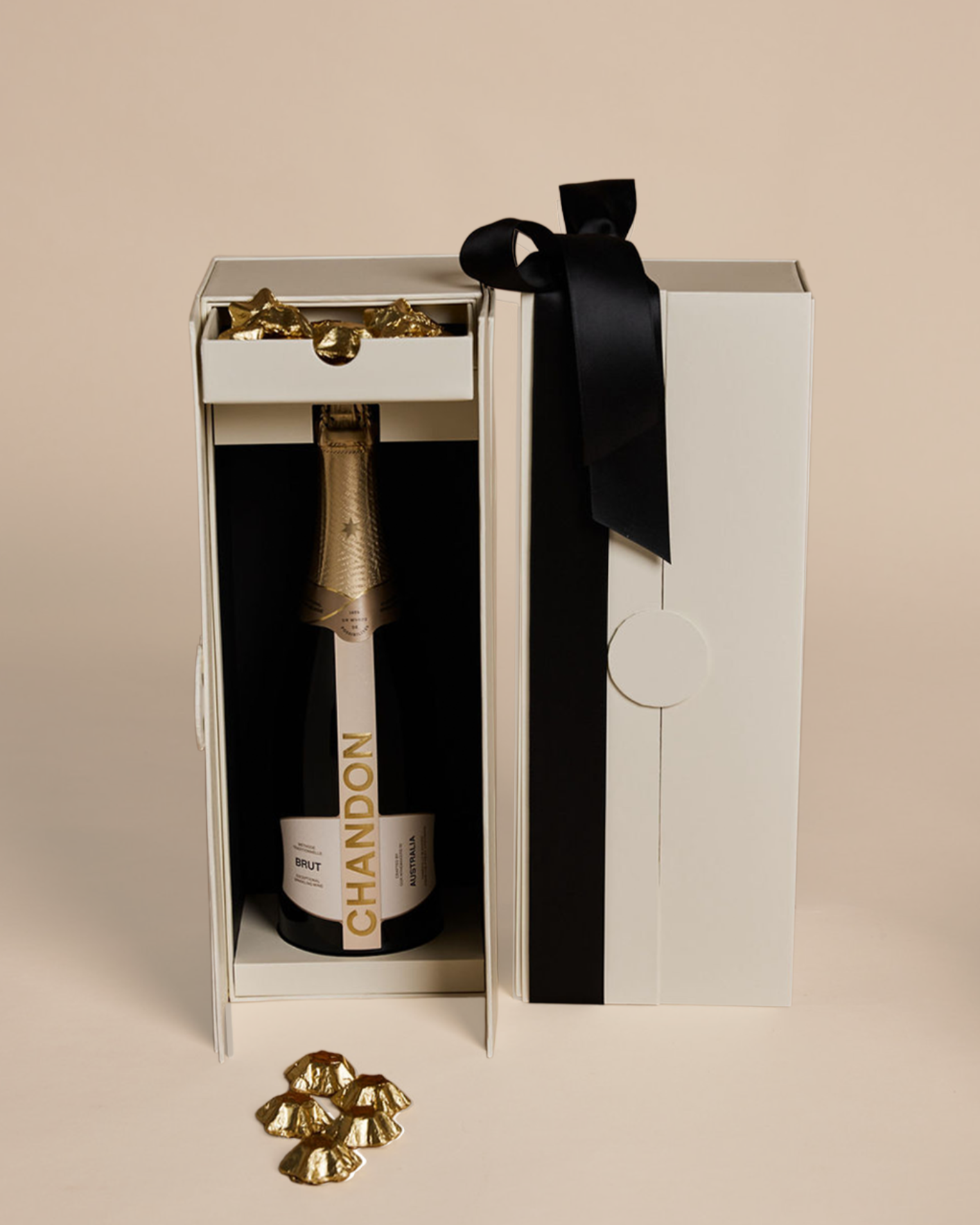 Parcelle | Luxury Chandon Christmas Cellar gift box by Parcelle featuring Chandon Brut NV sparkling wine and Belgian gold star chocolates in a signature double-door box.