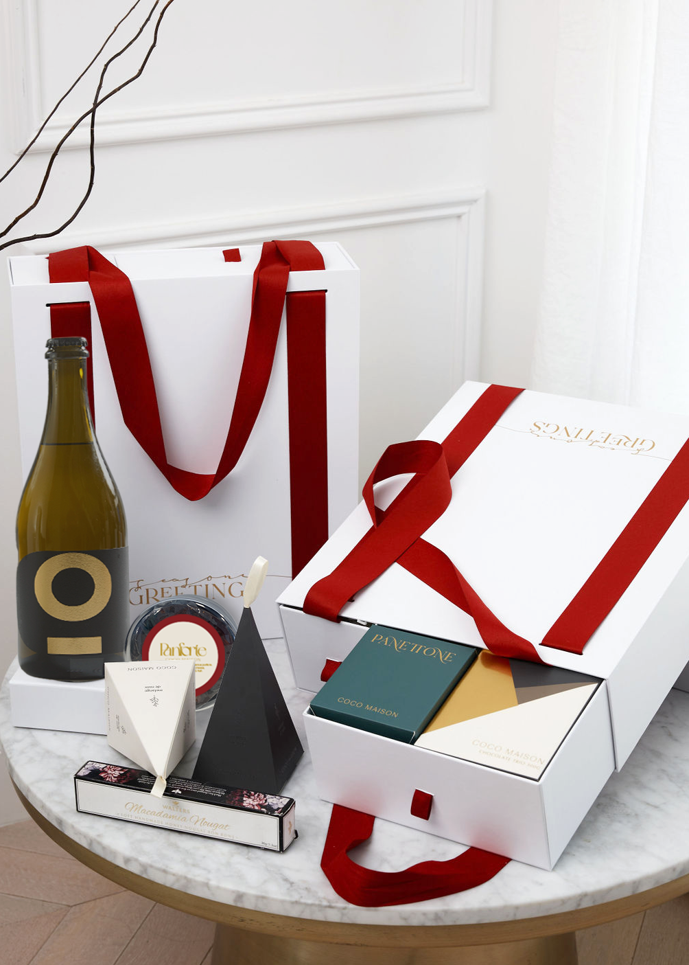 Charming Christmas Carryall gift box with ribbon handles, featuring gourmet treats like Coco Maison Deluxe Chocolate Trio, Posh Plonk Prosecco, perfect for corporate and personal holiday gifting.