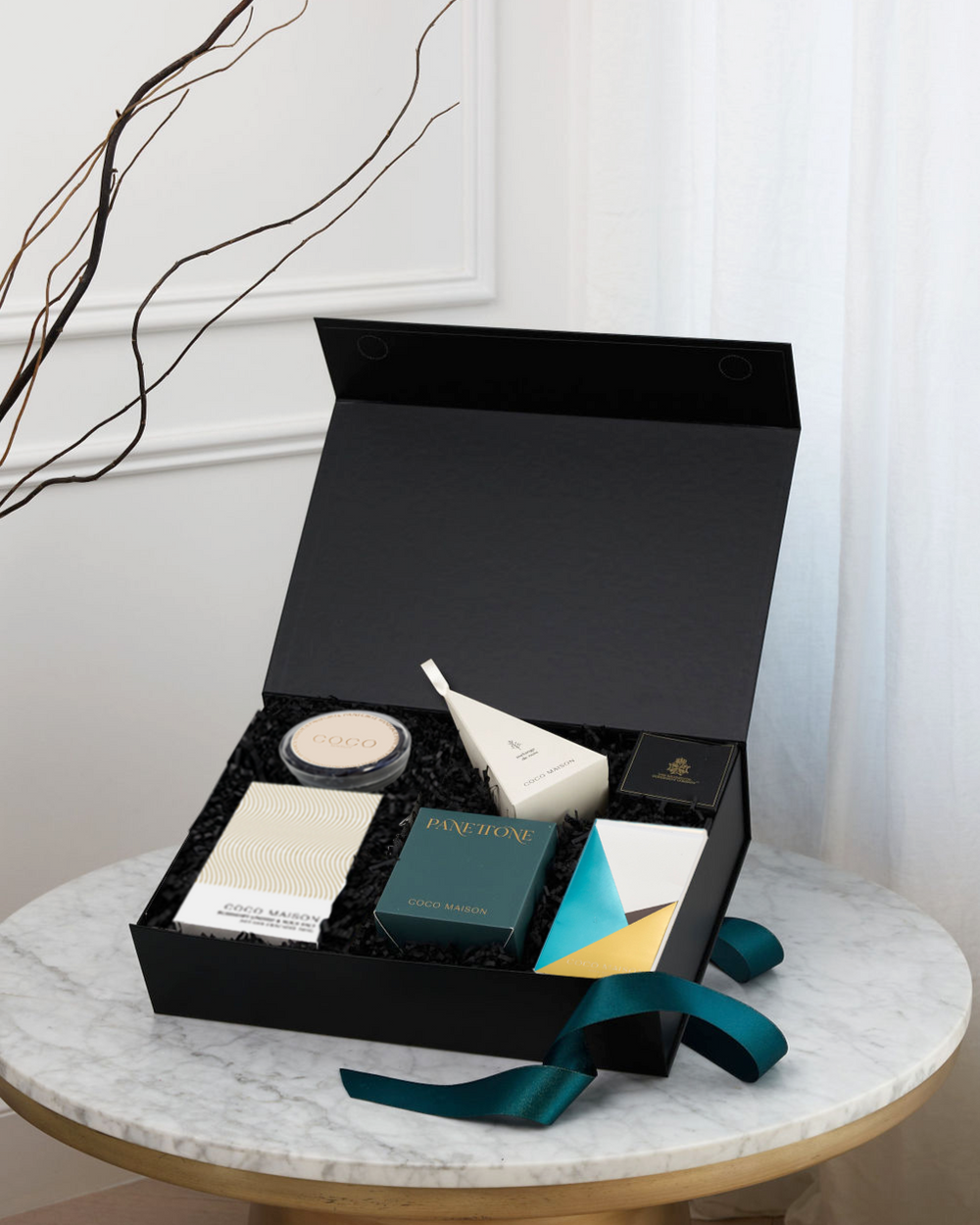 Parcelle | Christmas Bites luxury hamper with Choc Chip Panettone, Pistachio Knafeh Chocolate Bar, BBQ Cashews, Rosemary Crackers, Tapenade, and Panforte, presented in Parcelle gift box with Australiana or Candy Stripe sleeve, free branding available