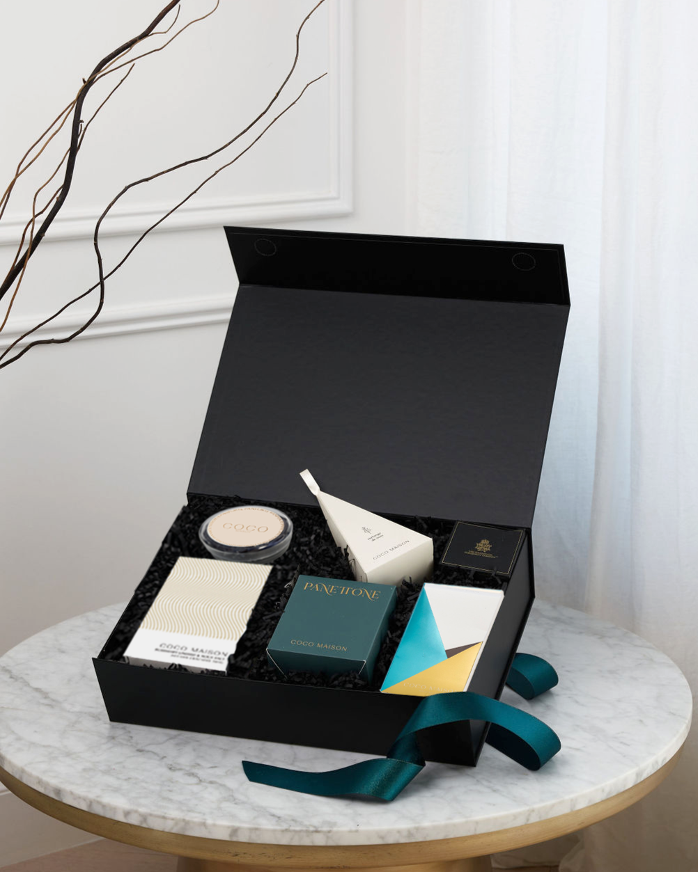 Parcelle | Christmas Bites luxury hamper with Choc Chip Panettone, Pistachio Knafeh Chocolate Bar, BBQ Cashews, Rosemary Crackers, Tapenade, and Panforte, presented in Parcelle gift box with Australiana or Candy Stripe sleeve, free branding available