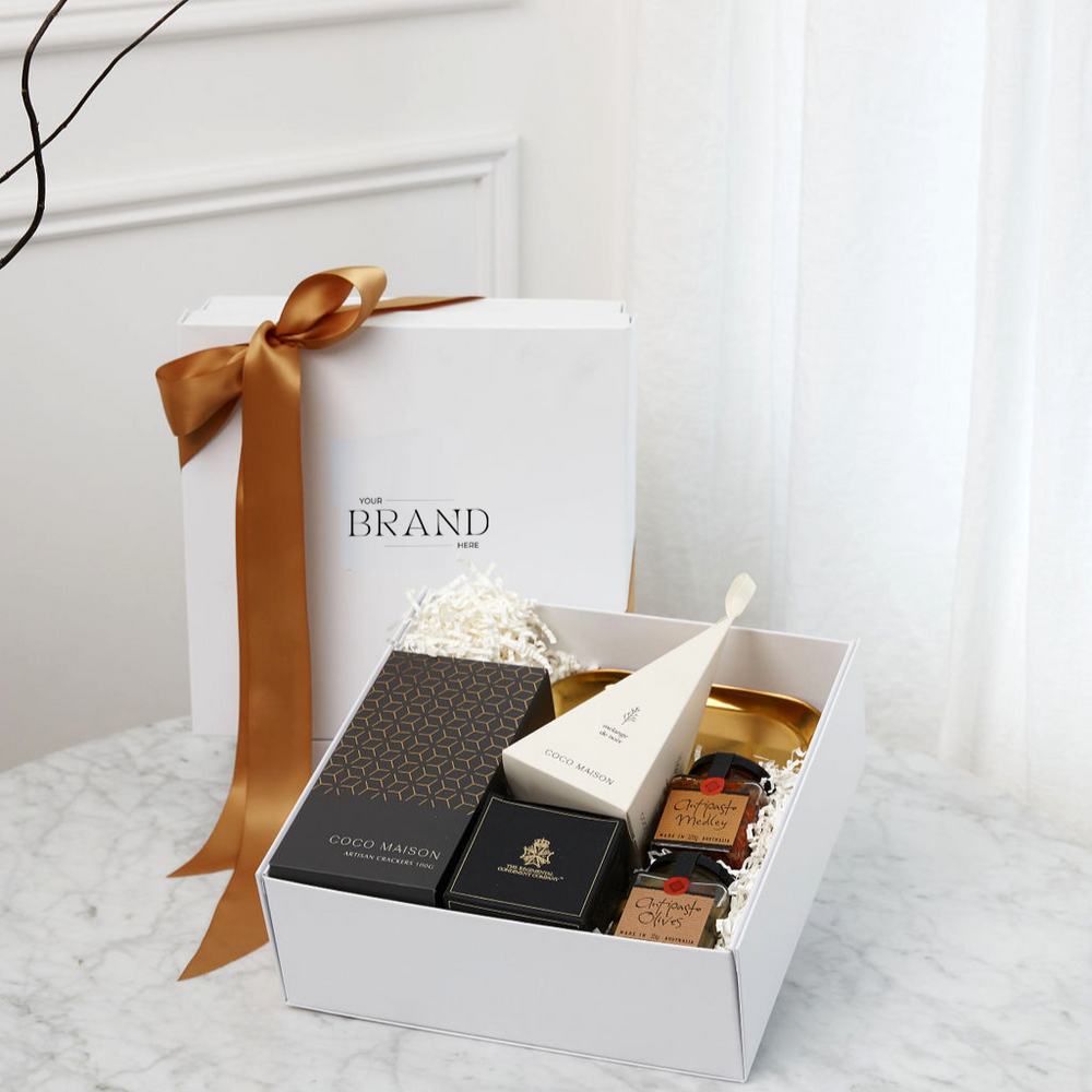 
                      
                        Parcelle | Luxury Christmas Mini Delights gift set in a Parcelle white or black gift box, featuring Coco Maison Caramelised Onion Artisan Crackers, Ogilvie & Co Antipasto Medley, Olives, G for George Red Capsicum Tapenade, Coco Maison BBQ Spice Cashews, and a Luxury Gold Dish. Perfect for Christmas gifting and corporate presents
                      
                    