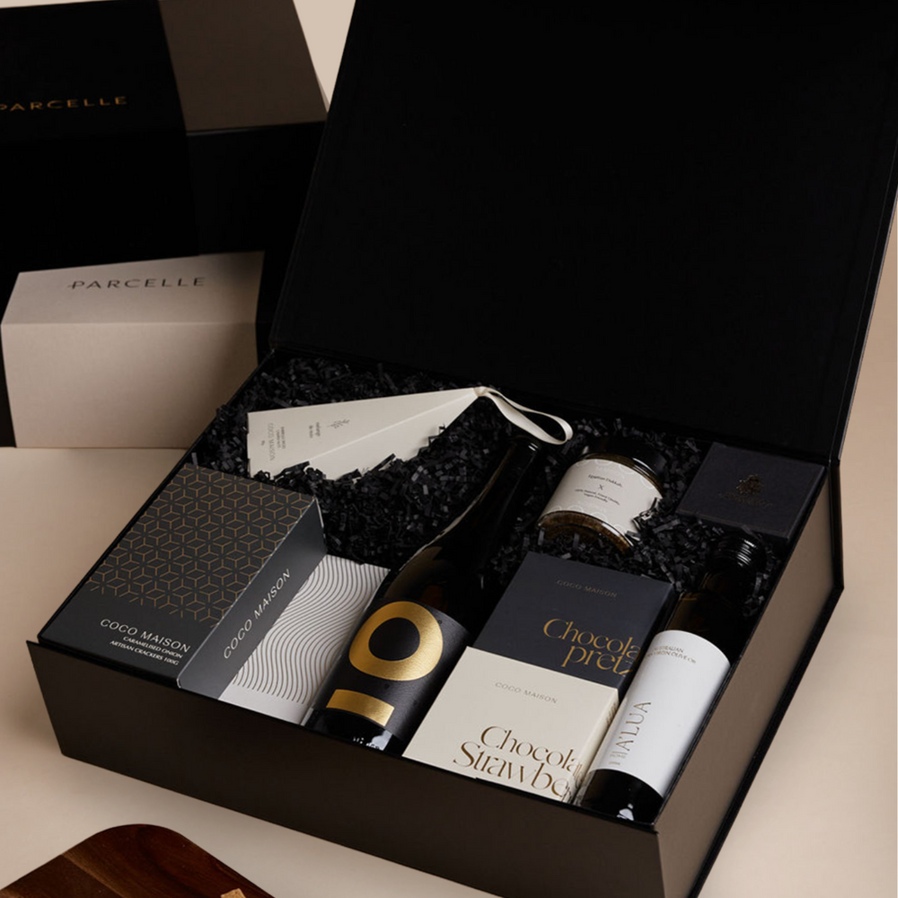 Parcelle | Corporate Prosecco Christmas Hamper with Posh Plonk Prosecco, olive oil, savoury crackers, tapenade, chocolates and cashews in Parcelle XL Gift Box with custom logo branding and ribbon