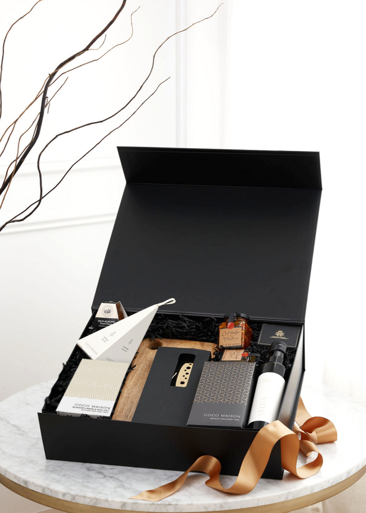 Parcelle | Luxurious Christmas gift set in a white or black XL gift box featuring gourmet treats including a wooden board, A'lua Home Olive Oil, truffle chips, artisan crackers, and gold cheese & pate knife set