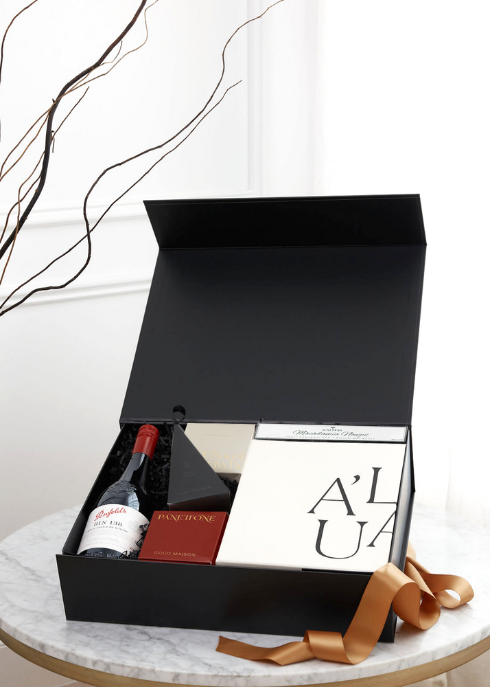 
                      
                        Parcelle | Open "Eat, Drink & Be Merry" gift box featuring Penfolds Bin 138 Barossa Valley GSM and Coco Maison gourmet chocolate treats, elegantly presented by Parcelle.
                      
                    