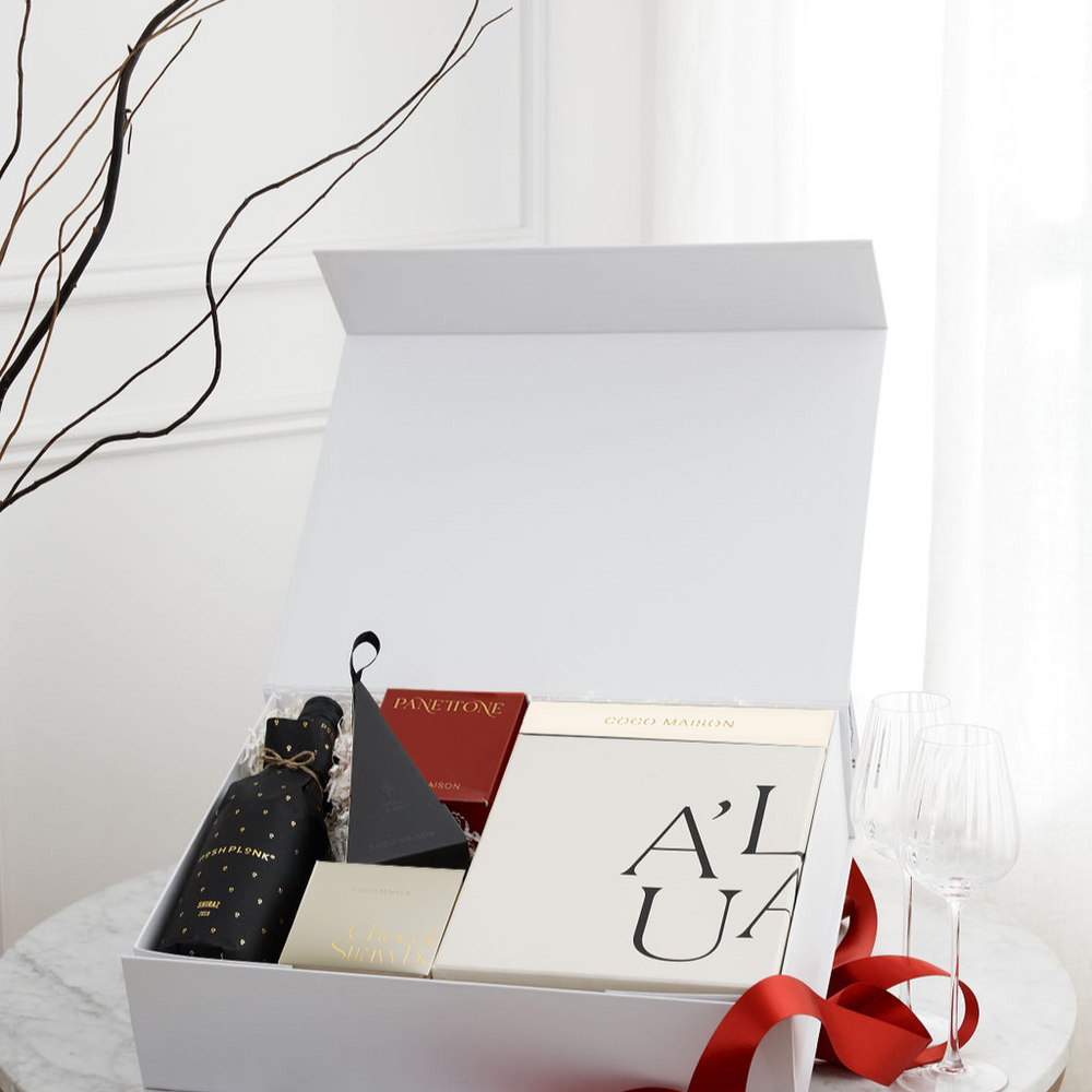 Parcelle | Merry Holiday luxury Christmas hamper with Posh Plonk Shiraz, Biscoff Chocolate Bar, Chocolate Strawberries, Chocolate Macadamias, and Premium Fluted Wine Glasses, presented in Parcelle XL Gift Box with Australiana or Candy Stripe sleeve, free branding available.
