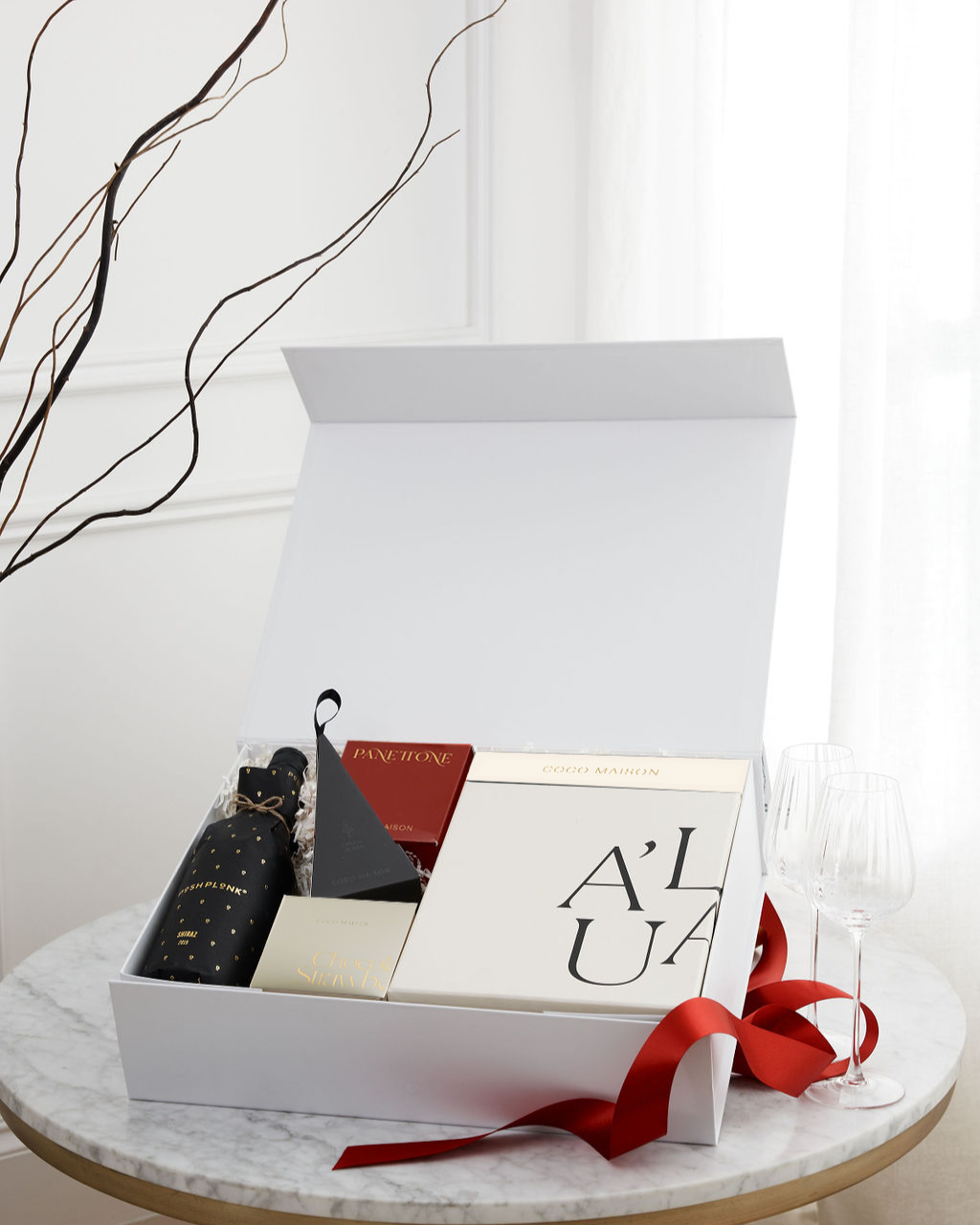 Parcelle | Merry Holiday luxury Christmas hamper with Posh Plonk Shiraz, Biscoff Chocolate Bar, Chocolate Strawberries, Chocolate Macadamias, and Premium Fluted Wine Glasses, presented in Parcelle XL Gift Box with Australiana or Candy Stripe sleeve, free branding available.