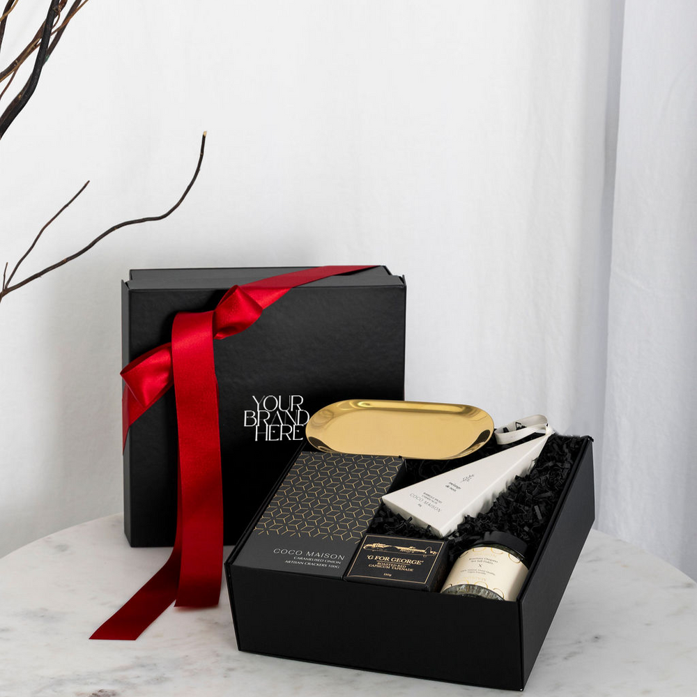 Christmas Mini Delights luxury hamper with crackers, tapenade, cashews, dukkah, and gold dish, presented in Parcelle gift box with Australiana or Candy Stripe sleeve, free branding available.