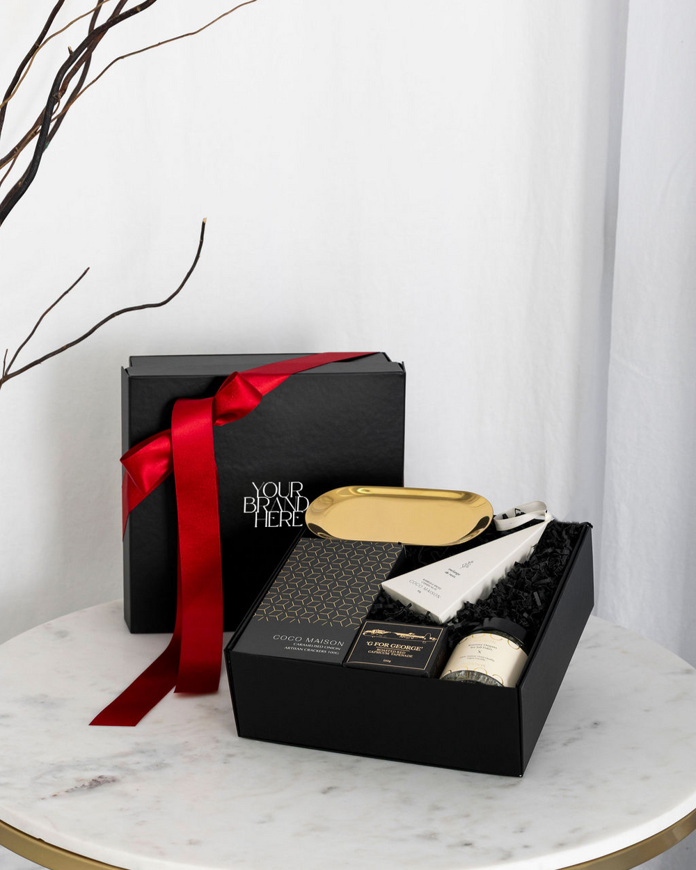 Christmas Mini Delights luxury hamper with crackers, tapenade, cashews, dukkah, and gold dish, presented in Parcelle gift box with Australiana or Candy Stripe sleeve, free branding available.