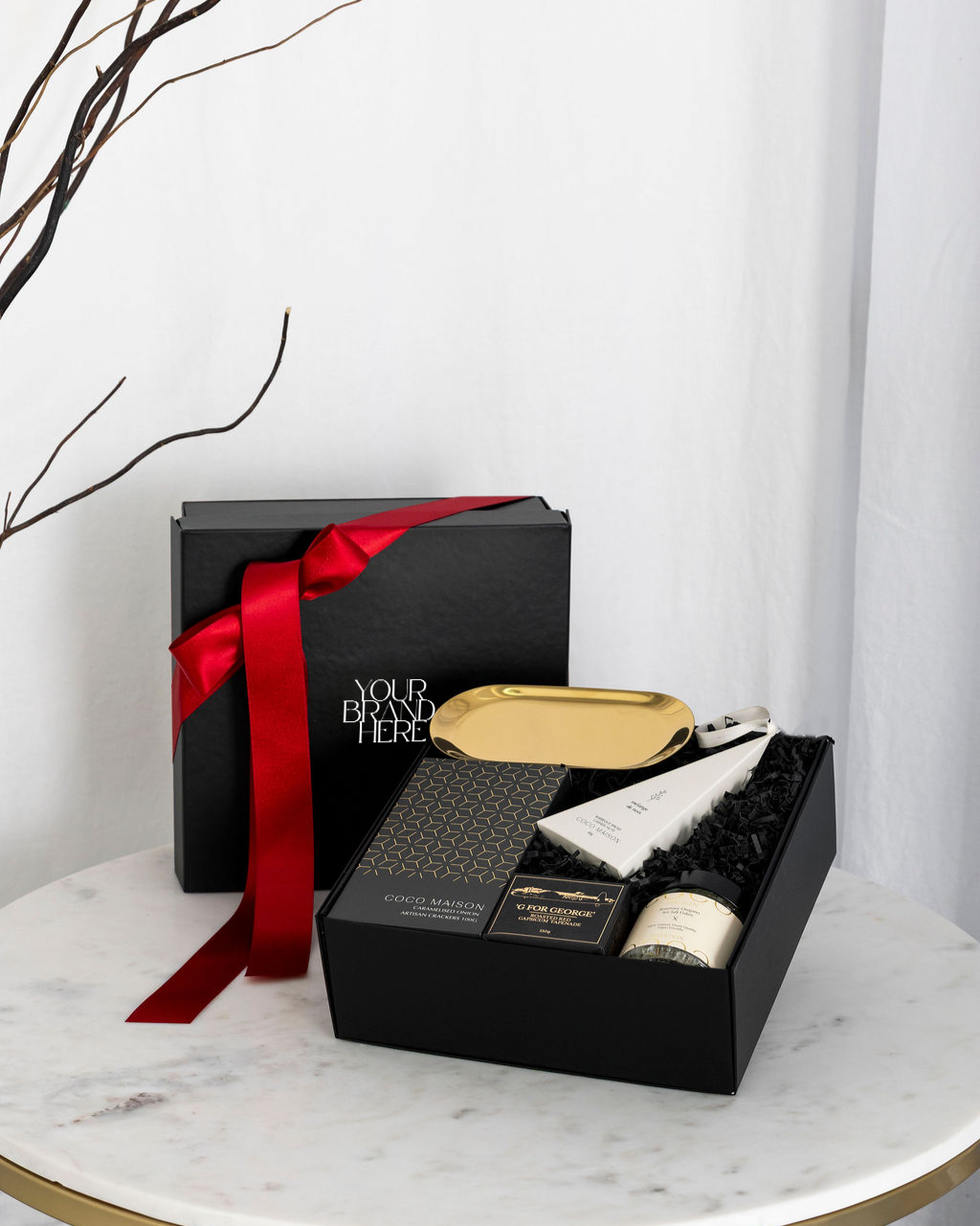 Christmas Mini Delights luxury hamper with crackers, tapenade, cashews, dukkah, and gold dish, presented in Parcelle gift box with Australiana or Candy Stripe sleeve, free branding available.