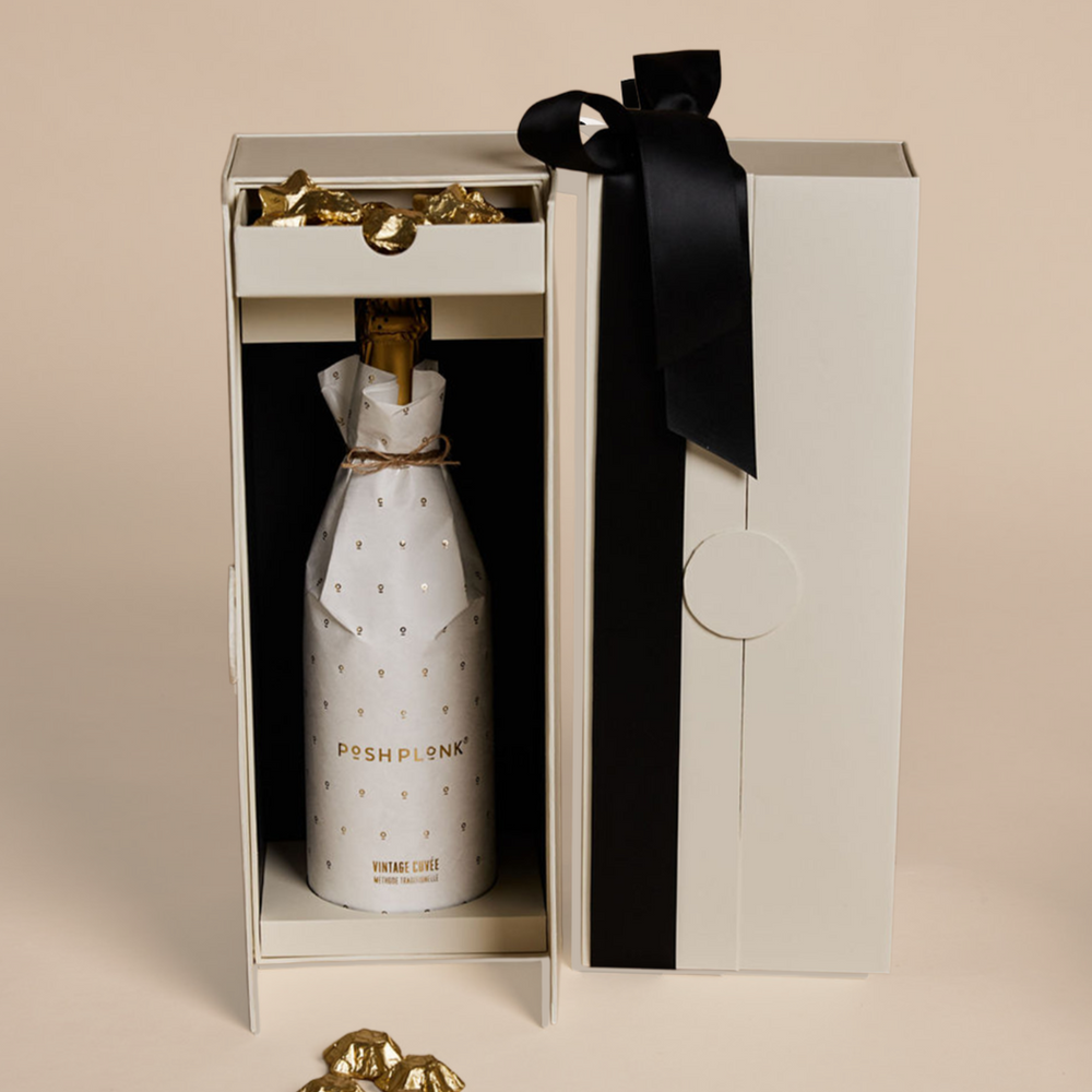 Parcelle | Parcelle Posh Cuvée Christmas Cellar featuring Posh Plonk Vintage Cuvée and Belgian gold star chocolates in a luxury double-door cellar gift box.