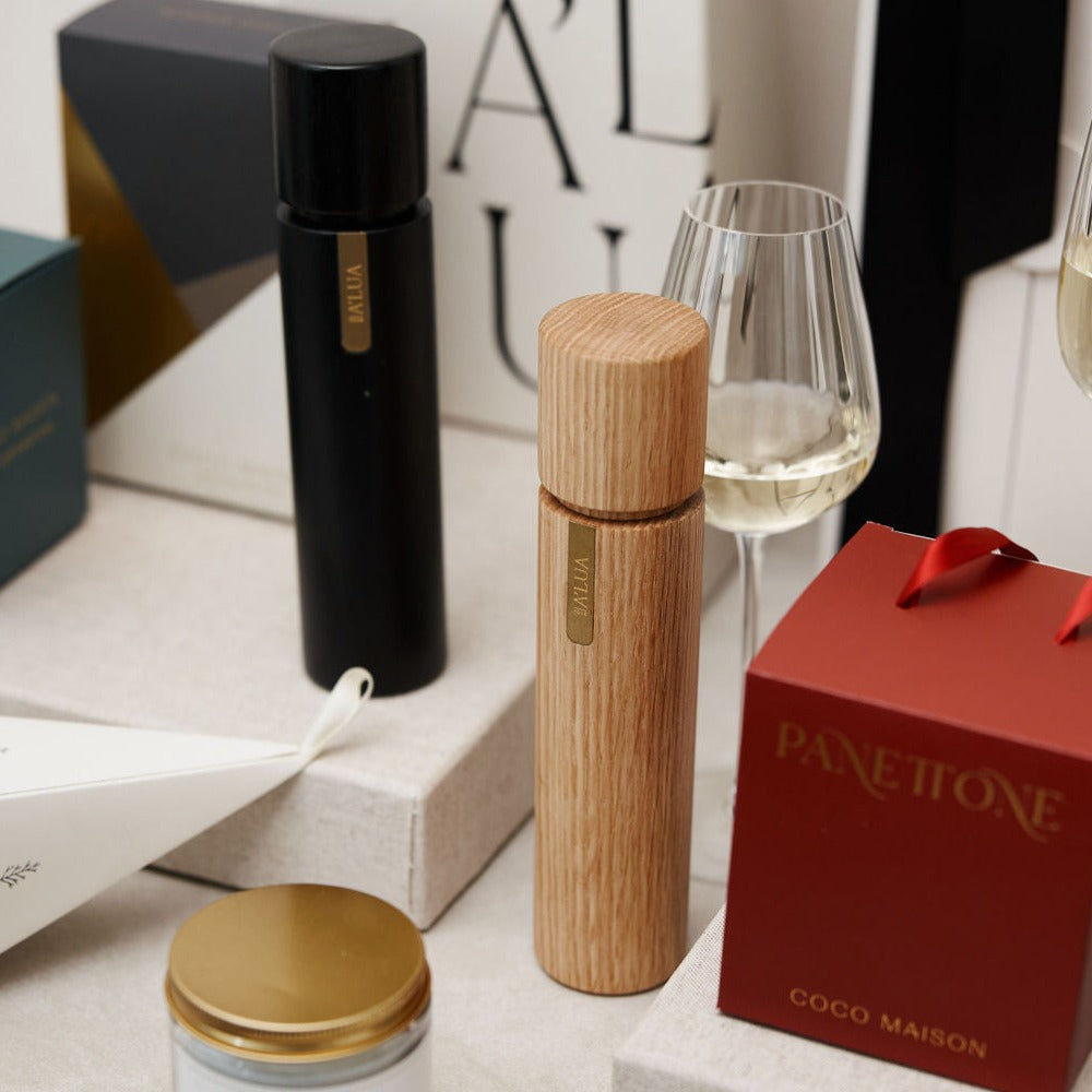 
                      
                        Parcelle | Detailed view of the Gourmet Bon Bon gift box, featuring A'lua Home Wooden Salt & Pepper Grinder, Australian Extra Virgin Olive Oil, and artisan crackers, perfect for sophisticated holiday gifting.
                      
                    