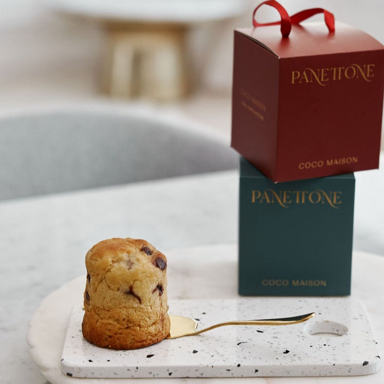 
                      
                        Parcelle | A selection of premium Christmas  Coco Maison Panettone arranged on a festive table, ideal for corporate gifting, showcasing luxury treats and custom branding options
                      
                    