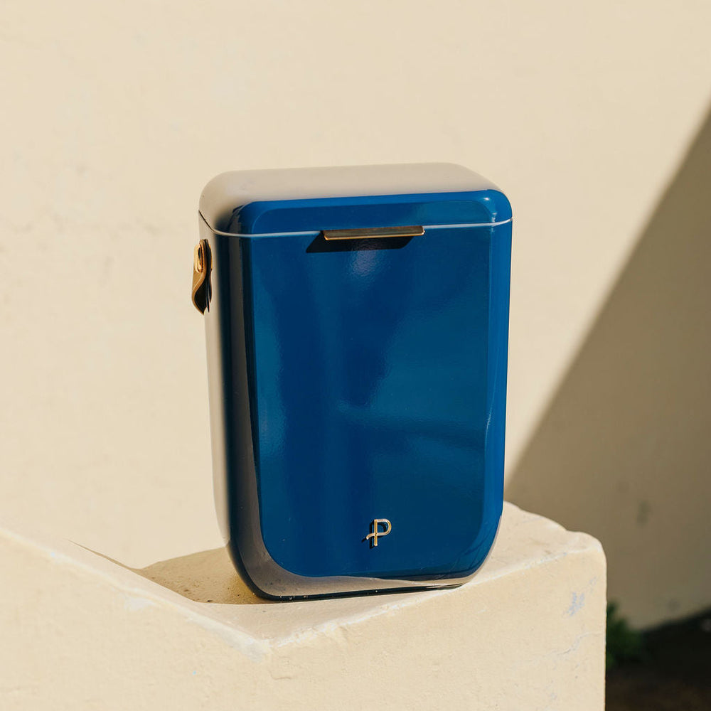 
                      
                        Parcelle | Close-up of French Navy Kewlr cooler showing PU leather shoulder strap and gold hardware, designed for luxury gifting
                      
                    