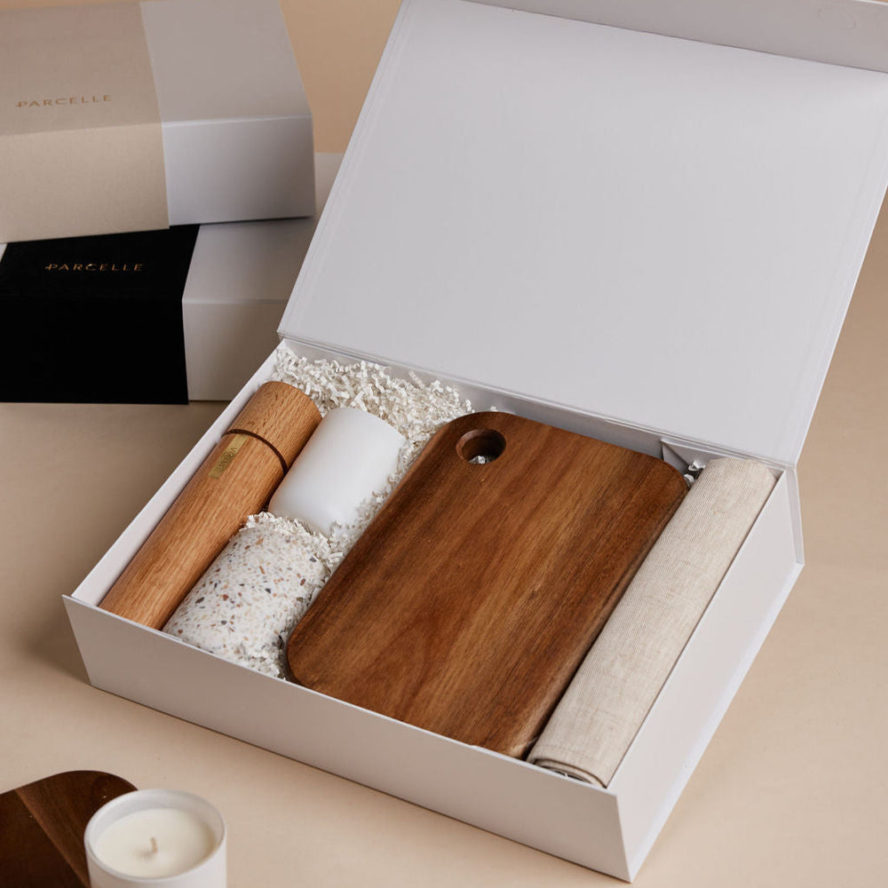Parcelle | The Suite real estate settlement gift box with linen tea towel, salt & pepper grinder, fig & cassis candle, terrazzo tumbler, and wooden board