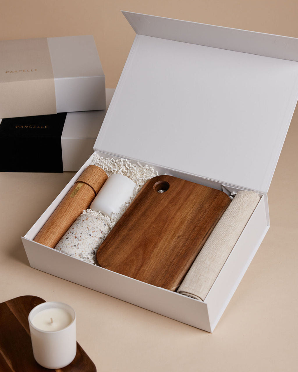 Parcelle | The Suite real estate settlement gift box with linen tea towel, salt & pepper grinder, fig & cassis candle, terrazzo tumbler, and wooden board