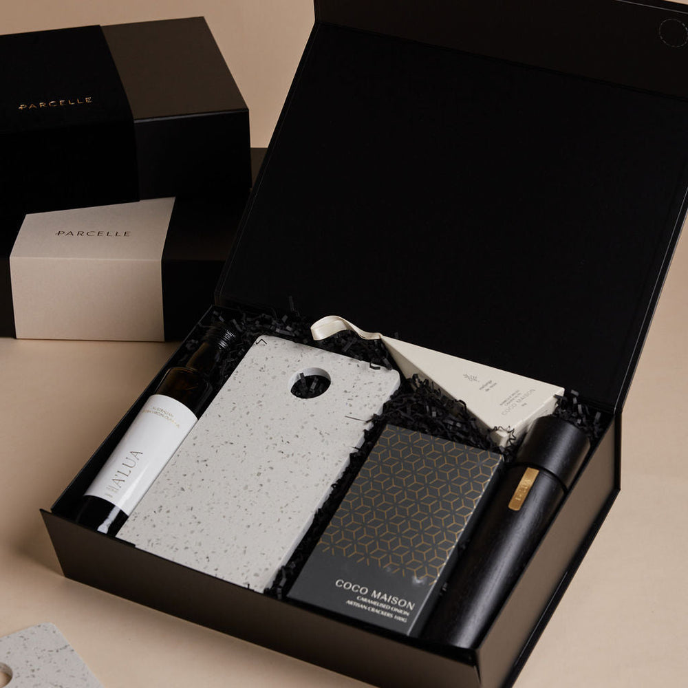 Parcelle | The Studio settlement hamper with olive oil, artisan crackers, terrazzo board, BBQ cashews, and black wooden grinder — corporate housewarming gift Sydney