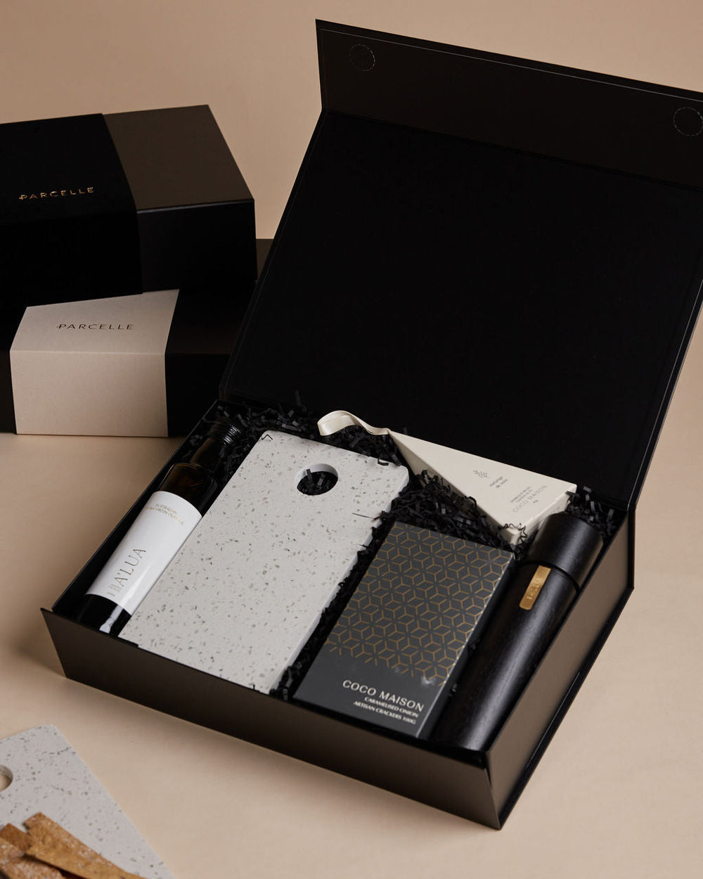 Parcelle | The Studio settlement hamper with olive oil, artisan crackers, terrazzo board, BBQ cashews, and black wooden grinder — corporate housewarming gift Sydney