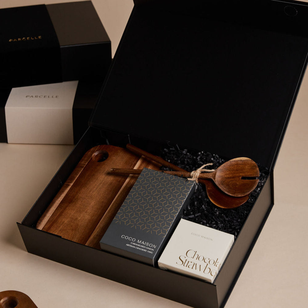 
                      
                        Parcelle | The Farm House housewarming hamper with salad servers, wooden board, artisan crackers, and chocolate-dipped strawberries in Parcelle signature gift box
                      
                    