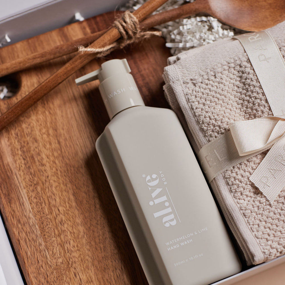 
                      
                        Parcelle | The Cottage housewarming hamper with olive oil, watermelon & lime hand wash, wooden board, salad servers, and Bambury face washers — luxury settlement gift Sydney.
                      
                    