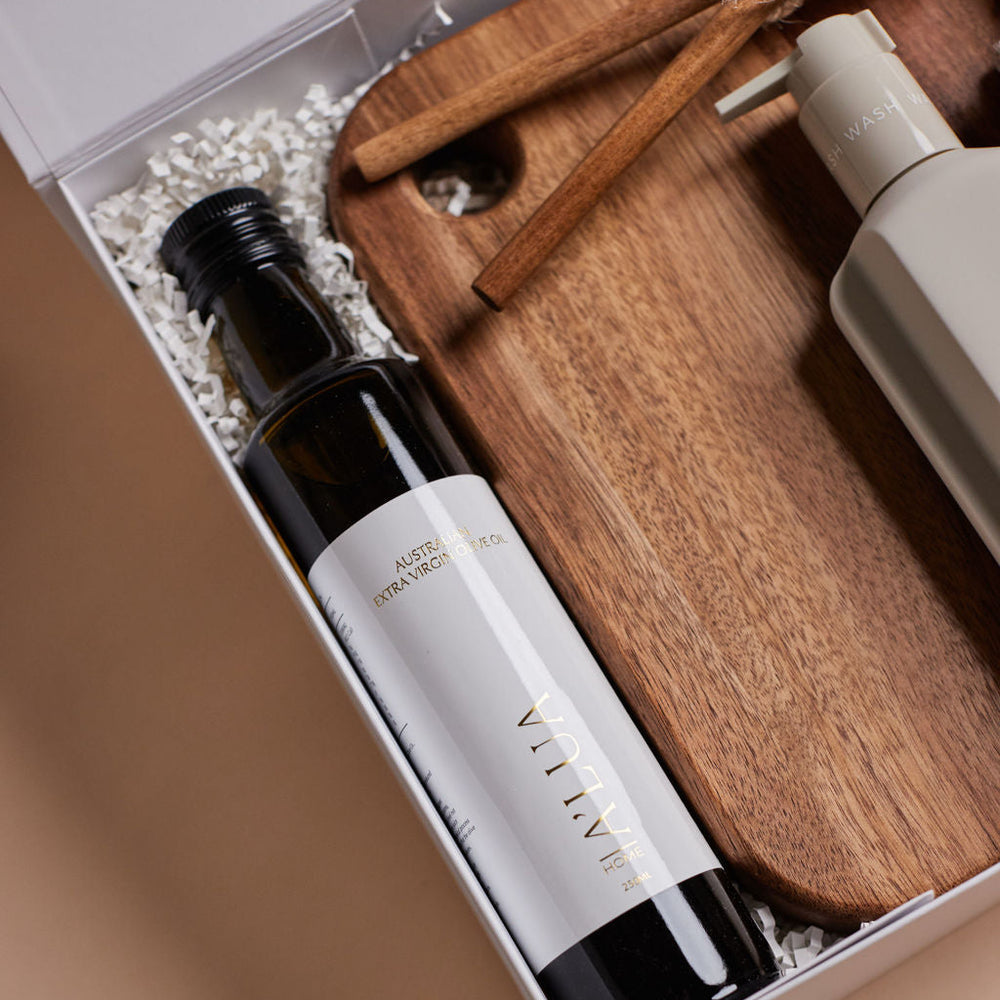
                      
                        Parcelle | The Cottage housewarming hamper with olive oil, watermelon & lime hand wash, wooden board, salad servers, and Bambury face washers — luxury settlement gift Sydney.
                      
                    
