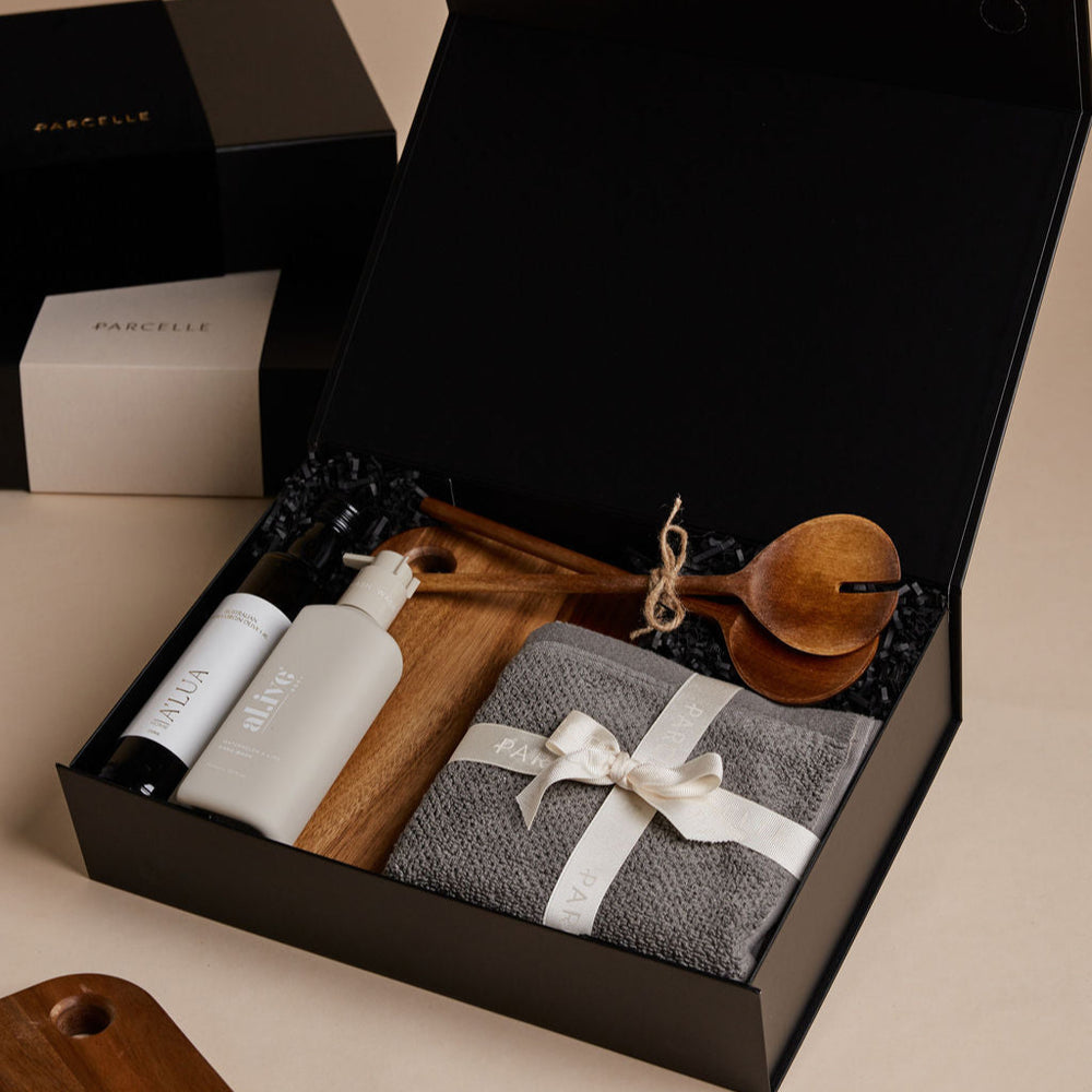 Parcelle | The Bungalow housewarming gift box with olive oil, hand wash, wooden salad servers, face washers, and wooden board — perfect real estate settlement hamper.