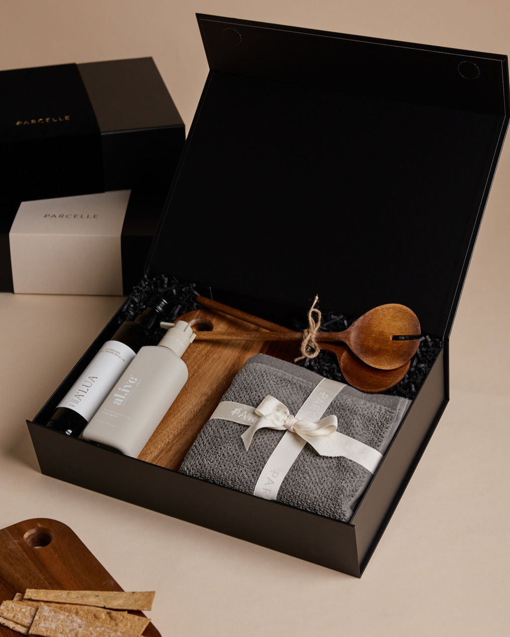 Parcelle | The Bungalow housewarming gift box with olive oil, hand wash, wooden salad servers, face washers, and wooden board — perfect real estate settlement hamper.