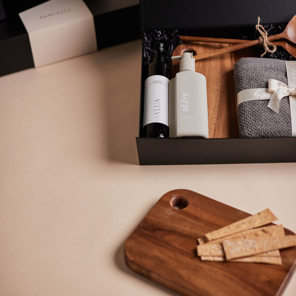 Parcelle | The Bungalow housewarming gift box with olive oil, hand wash, wooden salad servers, face washers, and wooden board — perfect real estate settlement hamper.