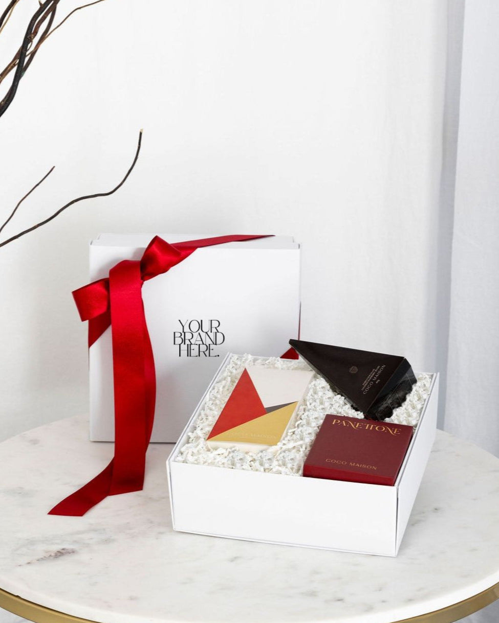 Parcelle | Be Festive luxury Christmas hamper with Pistachio Knafeh chocolate bar, Chocolate Chip Panettone, and Raspberry Jellies, presented in Parcelle gift box with Australiana or Candy Stripe sleeve, free branding available