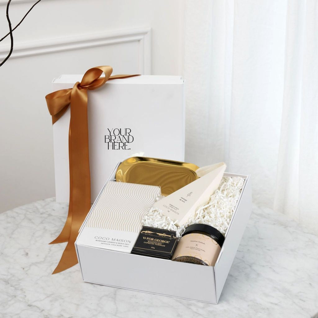 Parcelle | Hidden Drawer with Belgian Chocolates - Close-up of the hidden drawer in the gift box, revealing gold Belgian chocolate stars, adding luxury to this festive wine gift. | The Cellar Luxury Wine & Champagne Gift Box | Luxury Branded Corporate Gifting 