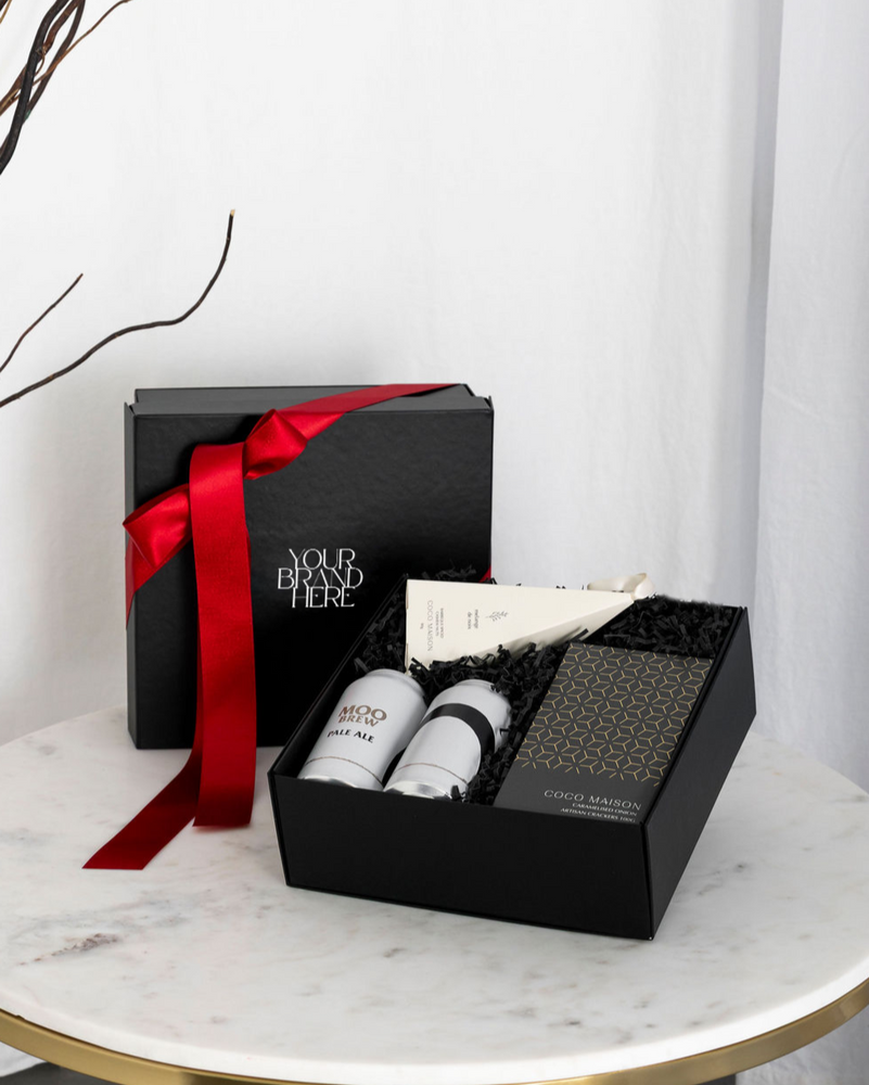 Parcelle | Saint Nic Christmas hamper with Moo Brew Pale Ale, Crackers, and BBQ Cashews, presented in Parcelle Signature Gift Box with Australiana or Candy Stripe sleeve, free branding available