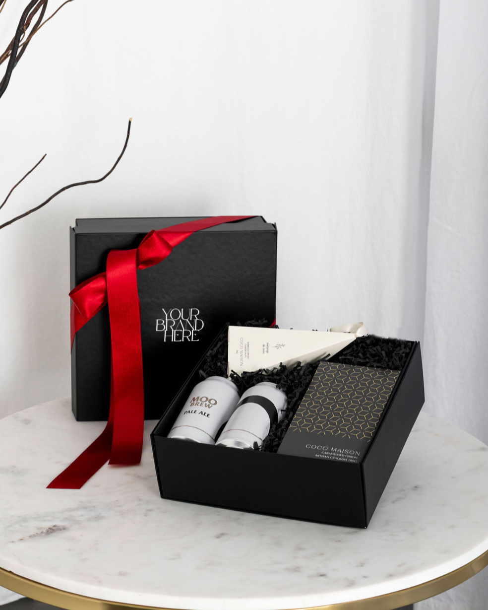 Parcelle | Saint Nic Christmas hamper with Moo Brew Pale Ale, Crackers, and BBQ Cashews, presented in Parcelle Signature Gift Box with Australiana or Candy Stripe sleeve, free branding available