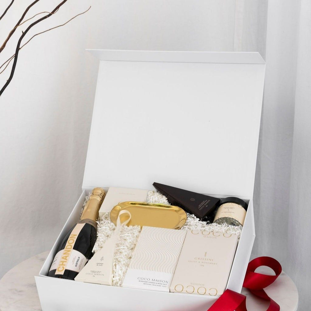 Parcelle | White Christmas luxury hamper with Chandon Sparkling, Grissini, Crackers, Cashews, Chocolates, Salt Flakes, and Gold Tray, presented in Parcelle Signature Large Gift Box with Australiana or Candy Stripe sleeve, free branding available