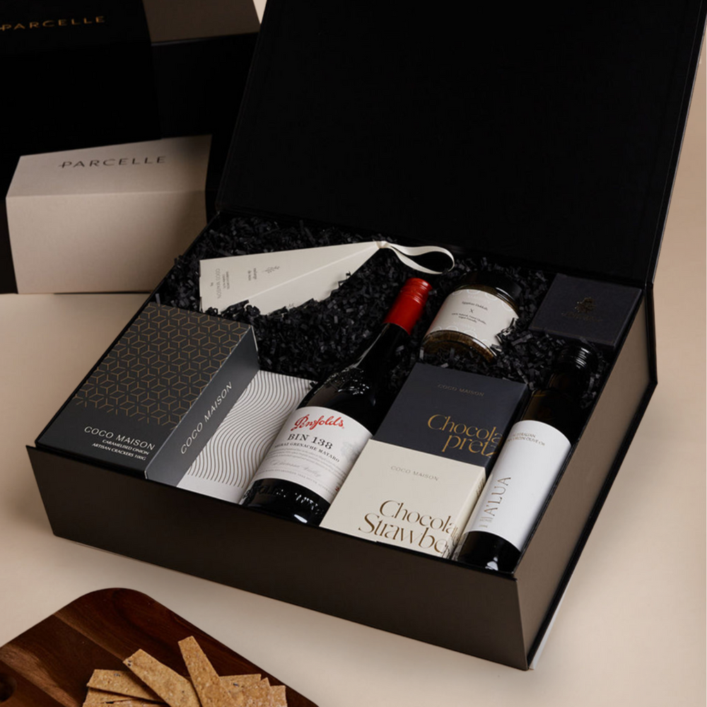 Parcelle | Corporate Penfolds Christmas Hamper with Bin 138 Shiraz GSM, olive oil, savoury crackers, tapenade, chocolates and cashews in Parcelle XL Gift Box with custom branding and ribbon